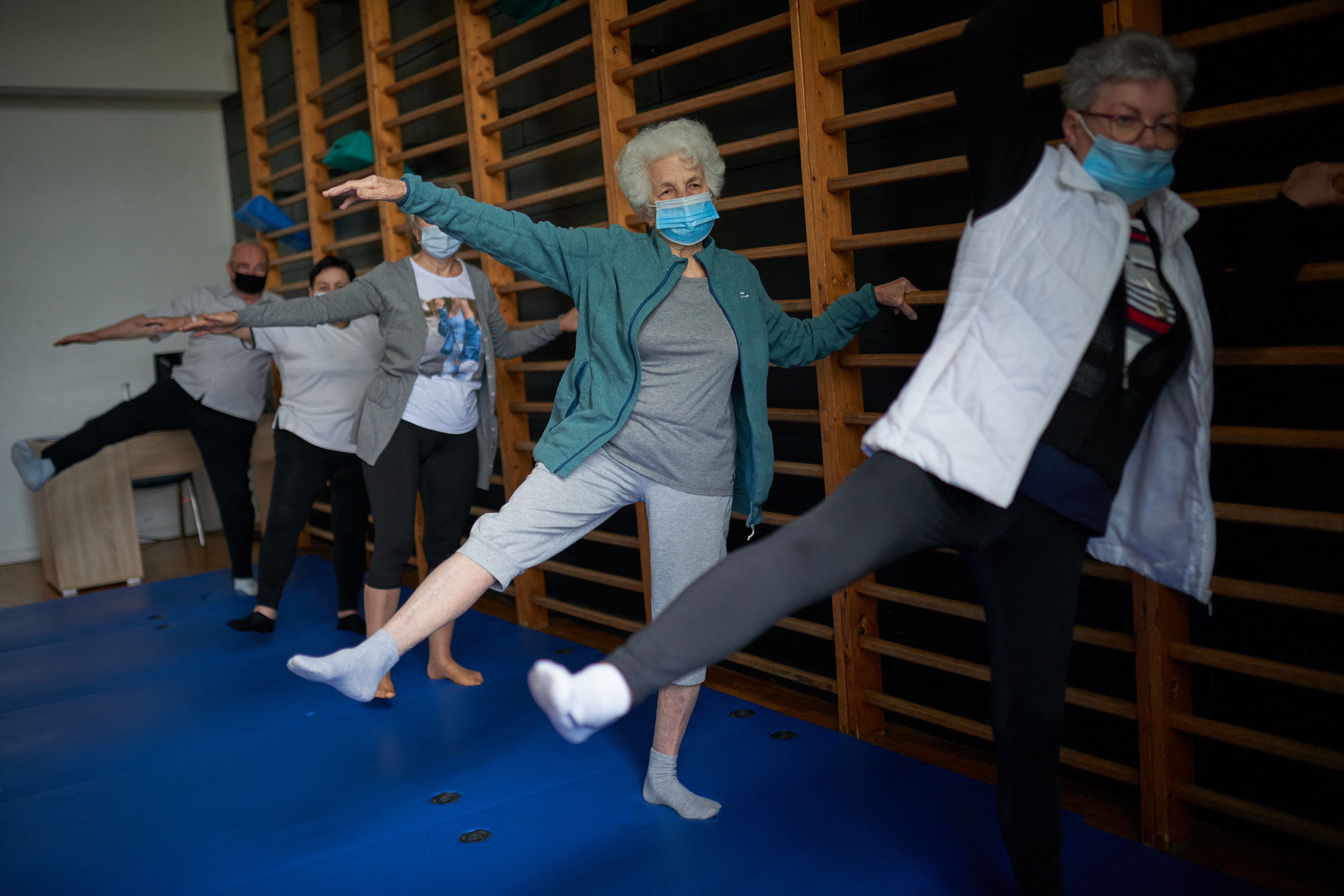 Covid survivors exercise during rehabilitation therapy in Poland