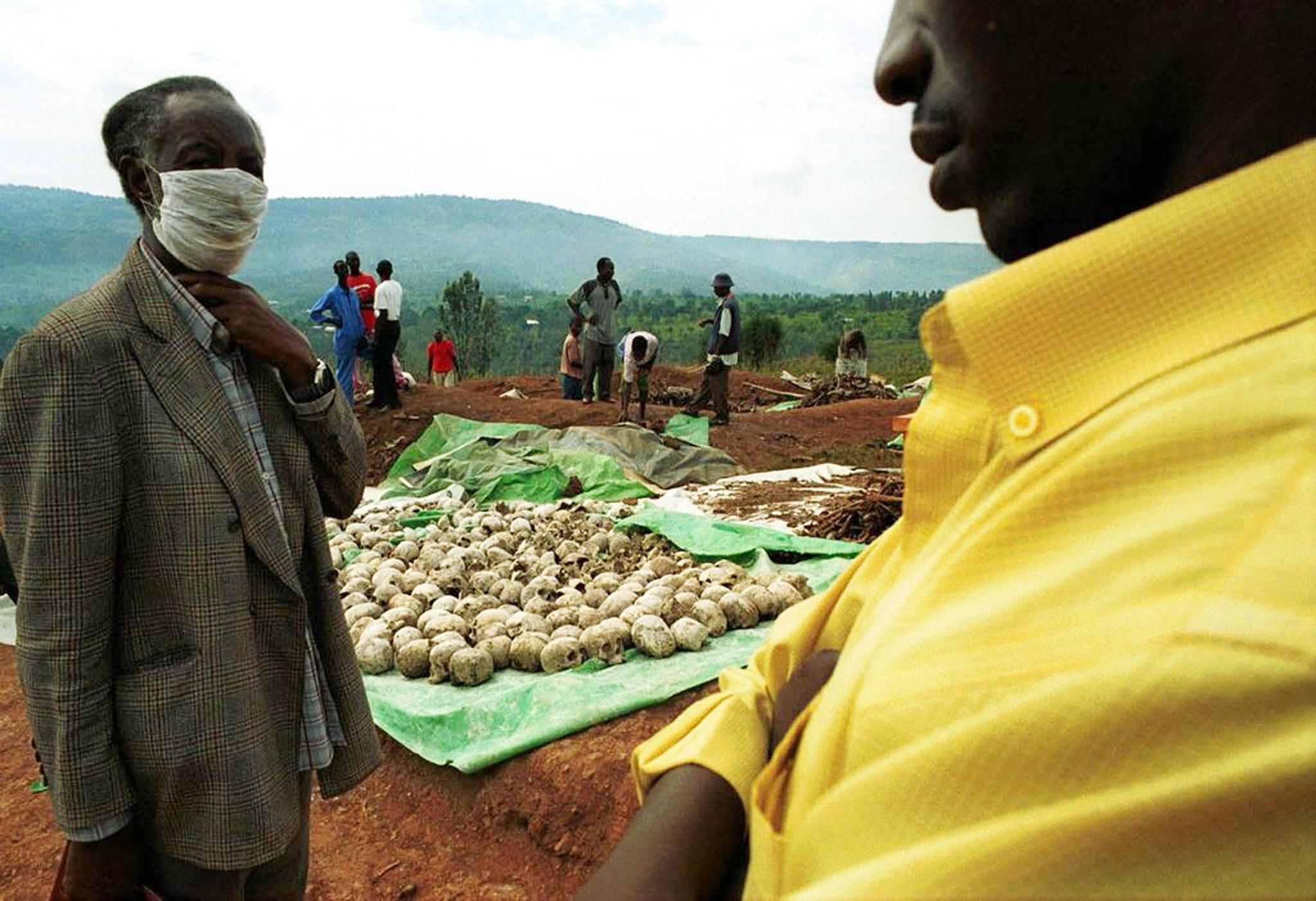 Workers unearth remains from a mass grave in Nyamirambo, close to Kigali in Rwanda, containing the remains of at least 32,000 people