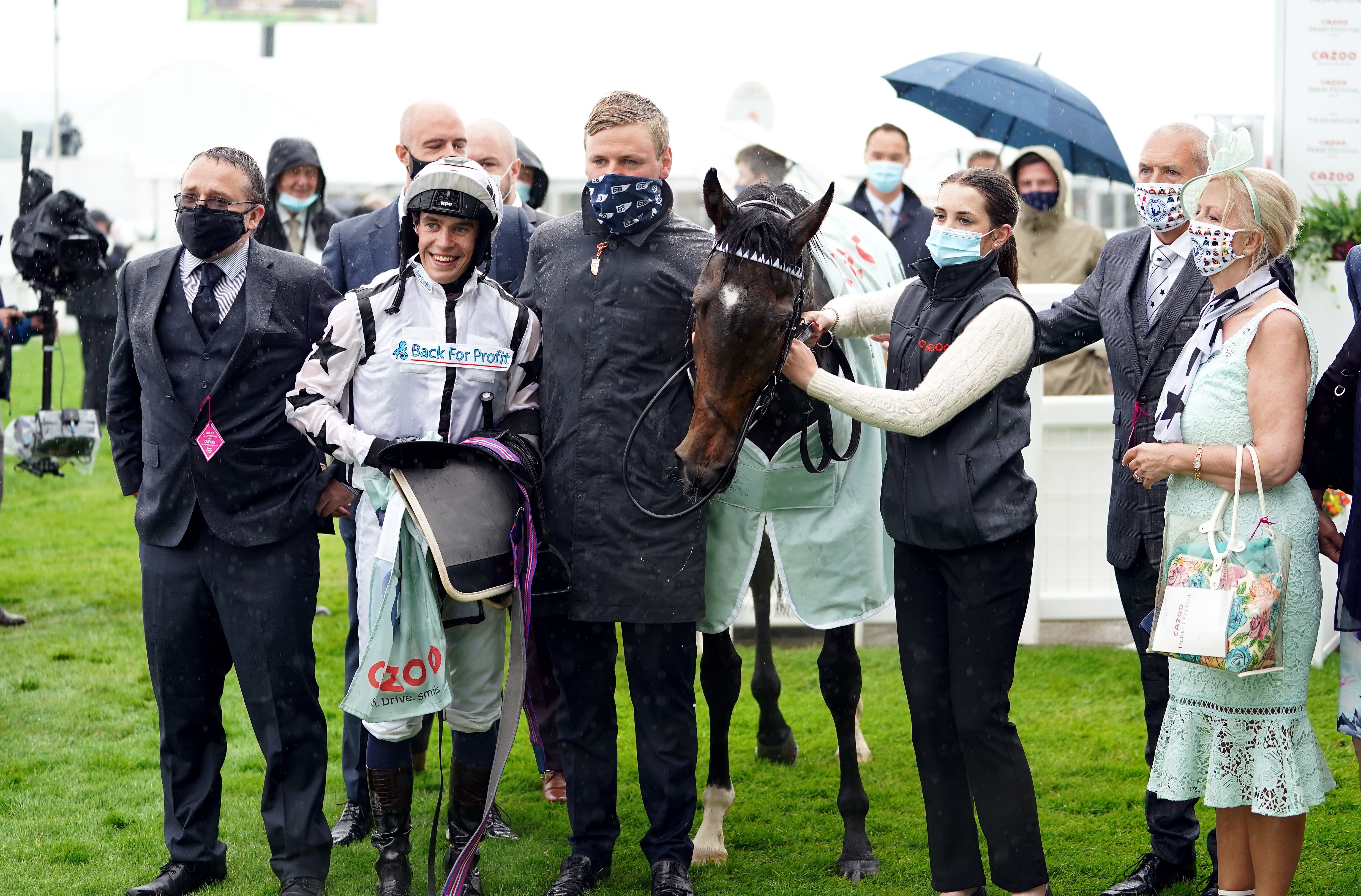 George Boughey (centre) at Epsom with Oscula