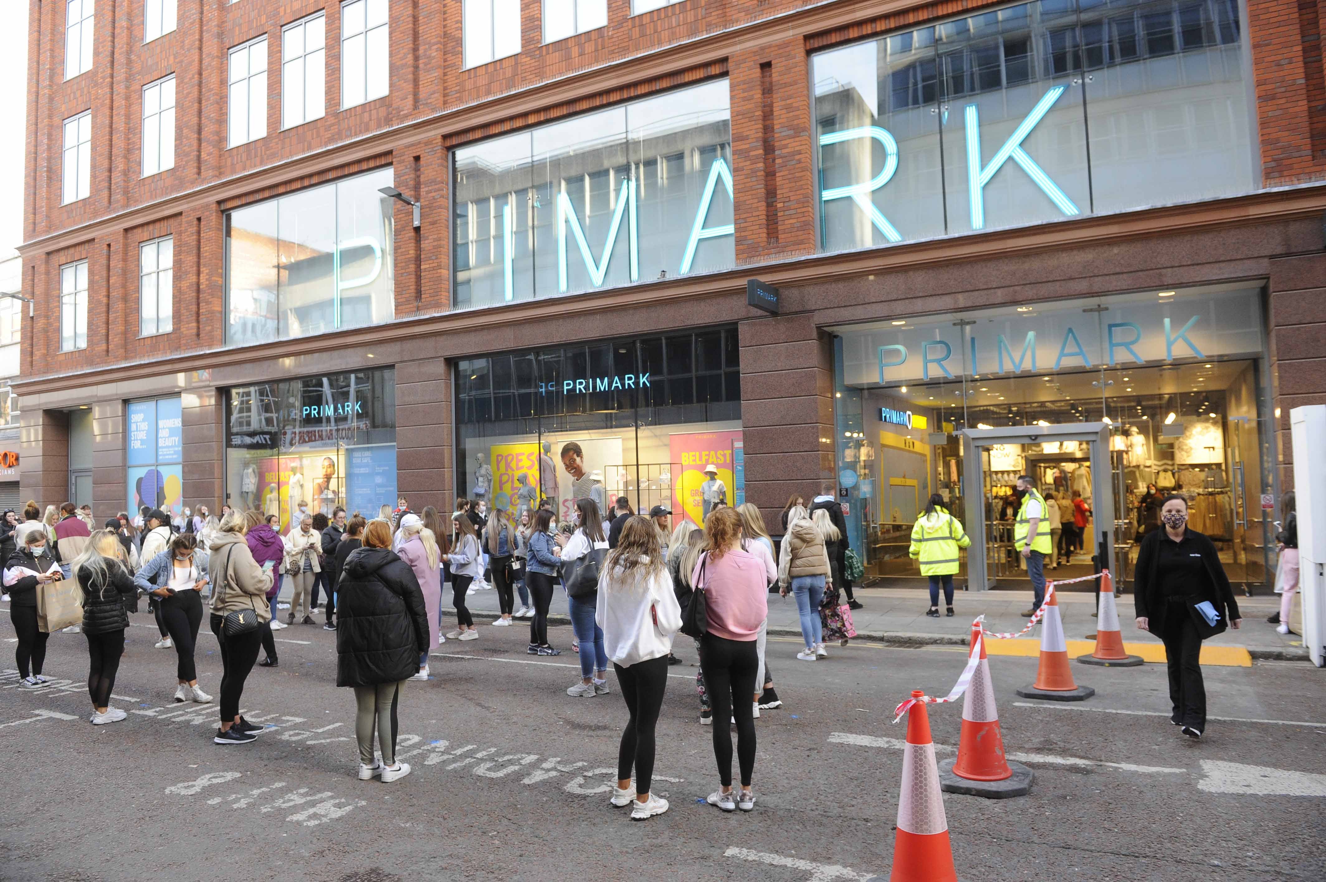 People queue at a Primark shop