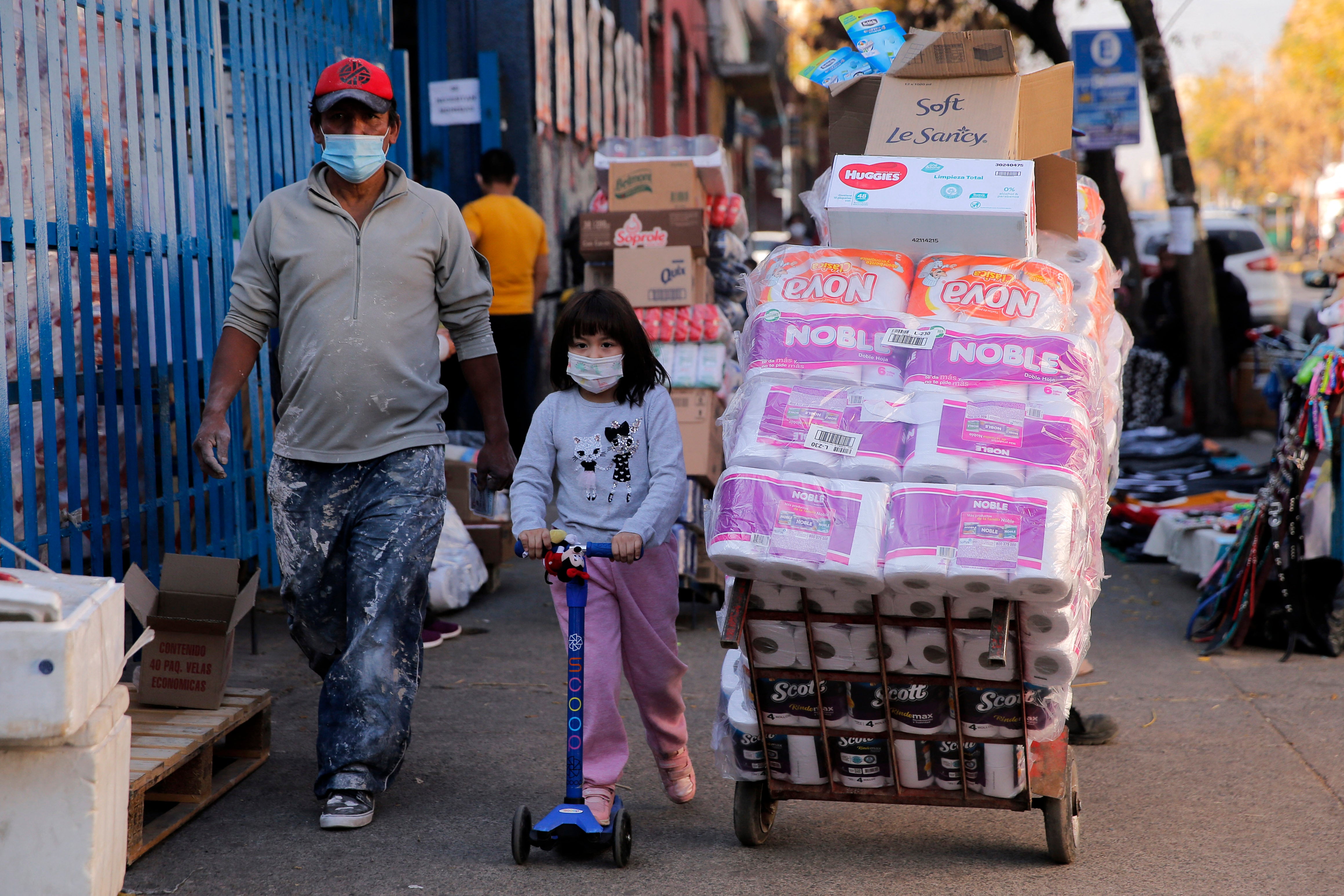 People walk at a commercial area of the Quinta normal commune in Santiago