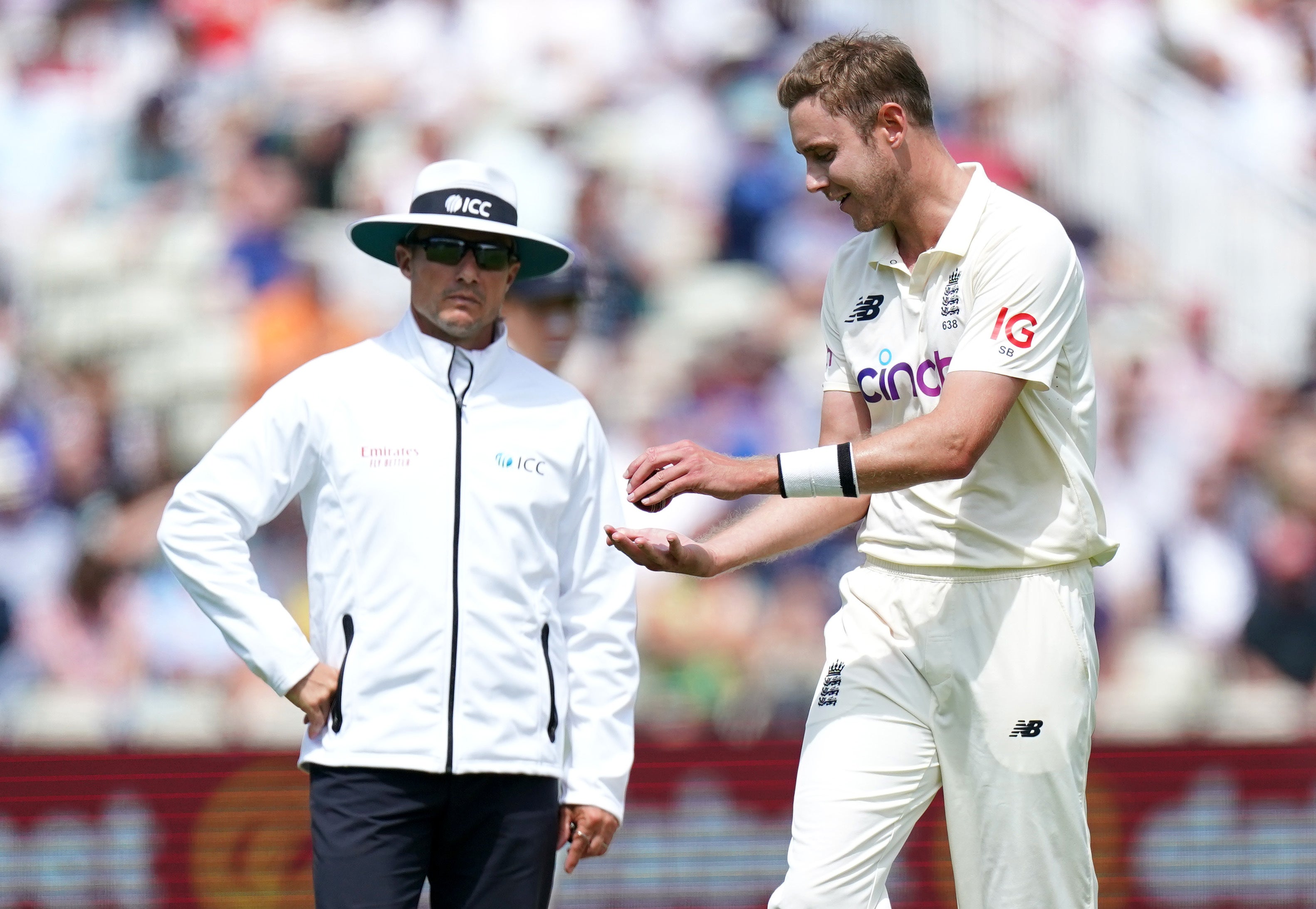 Stuart Broad speaks to the umpires after New Zealand’s Devon Conway was given not out