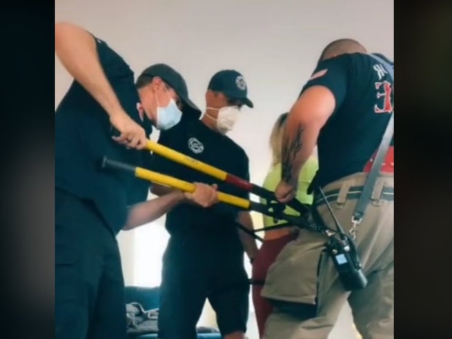 Firefighters free a woman from a chair in Michigan