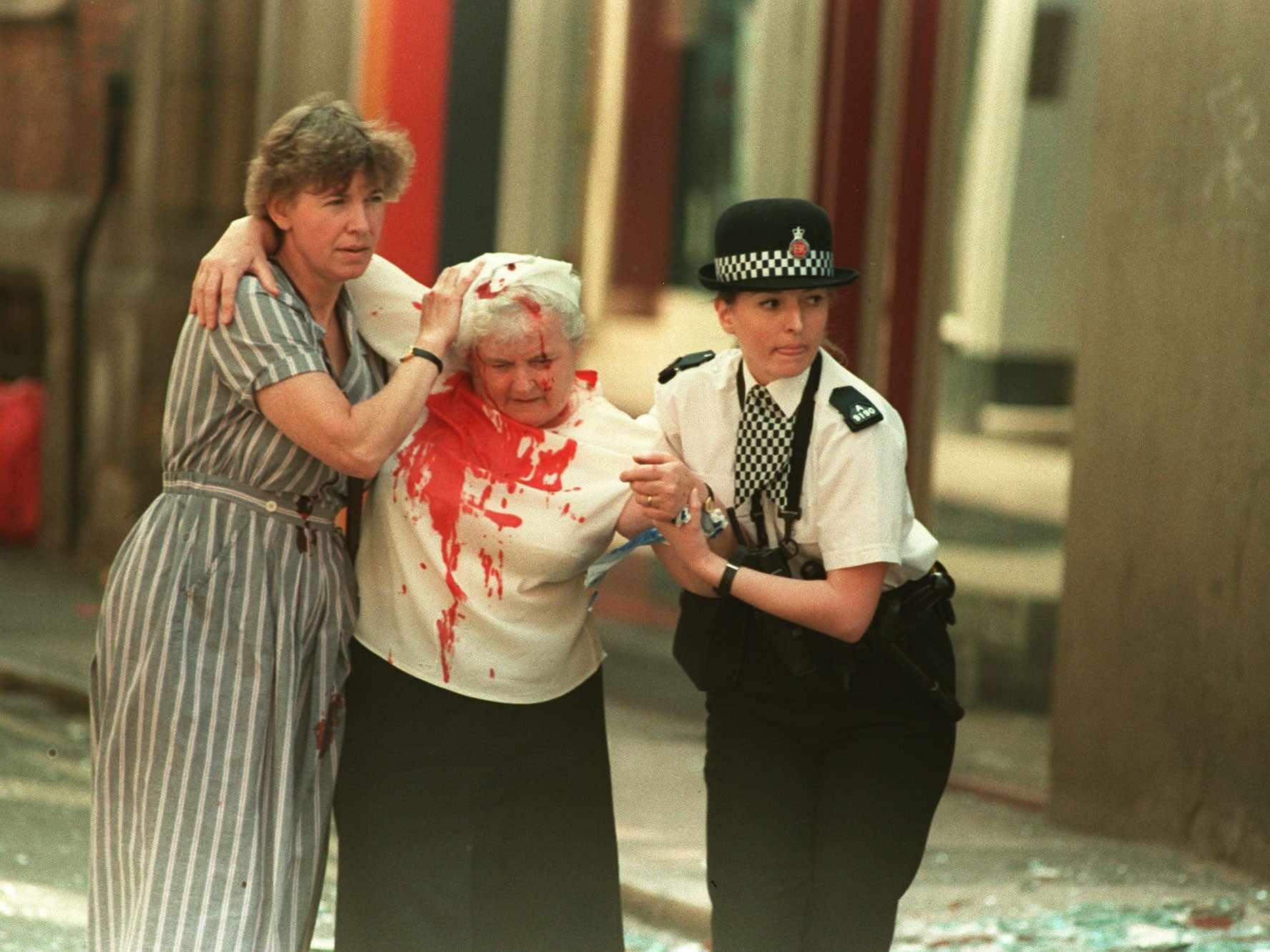 PC Vanessa Winstanley and another woman help a casualty away from the city centre