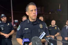 One suspect arrested and another remains at large after Texas mass shooting that injured 14 people