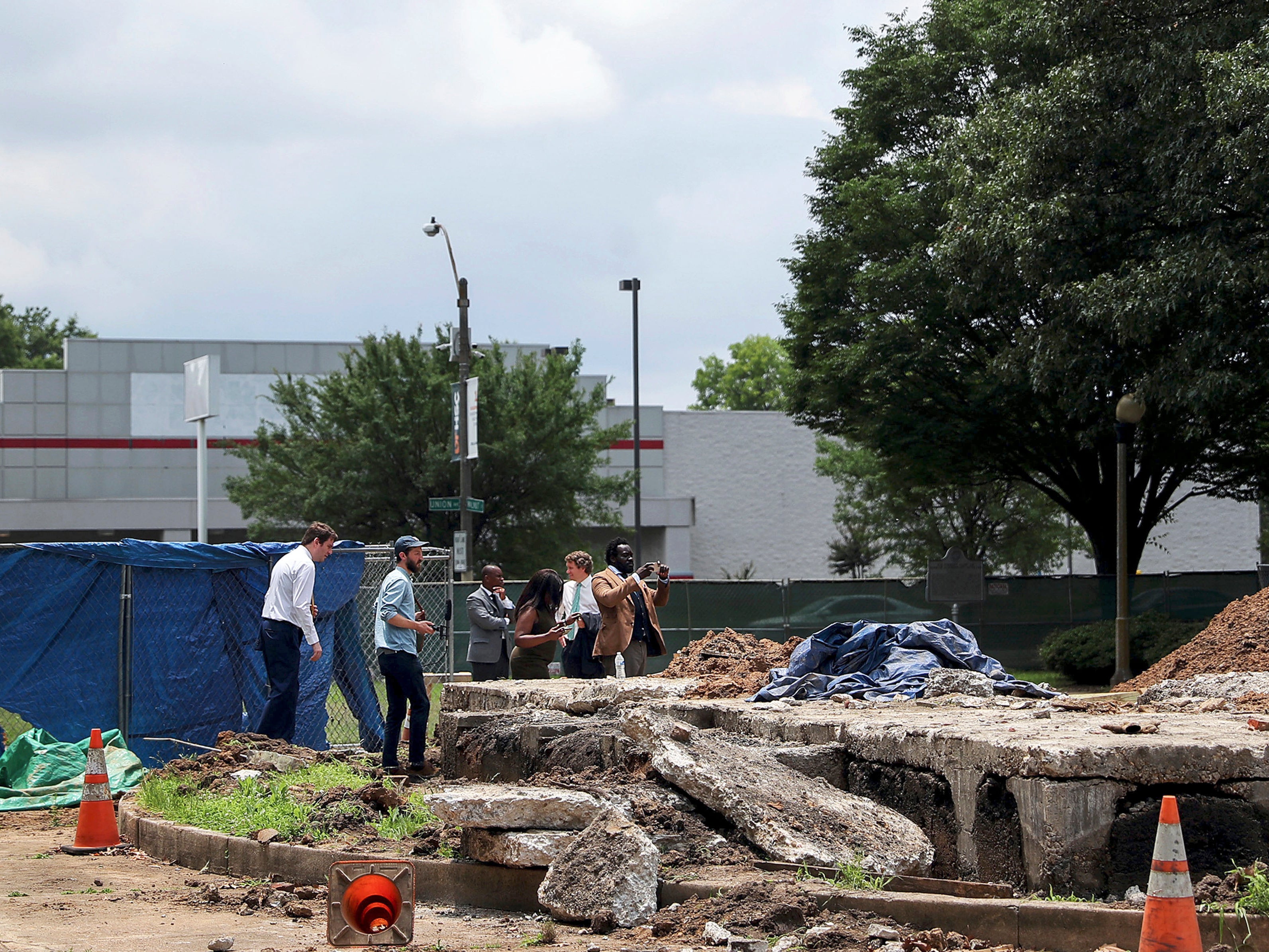 Members of the Memphis Greenspace board take a look at the now former grave of Confederate Gen. Nathan Bedford Forrest, in Memphis, Tenn., on Friday, June 11, 2021.