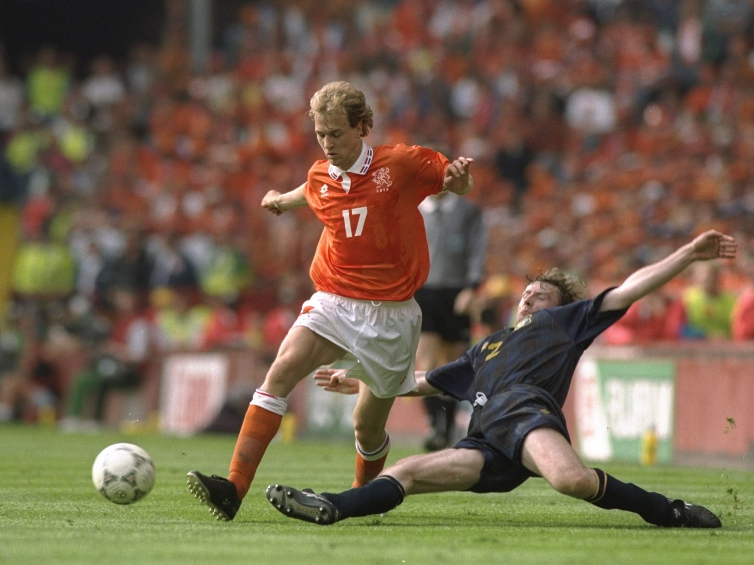 Stewart McKimmie tackles the Netherlands’ Jordi Cruyff in a 0-0 draw