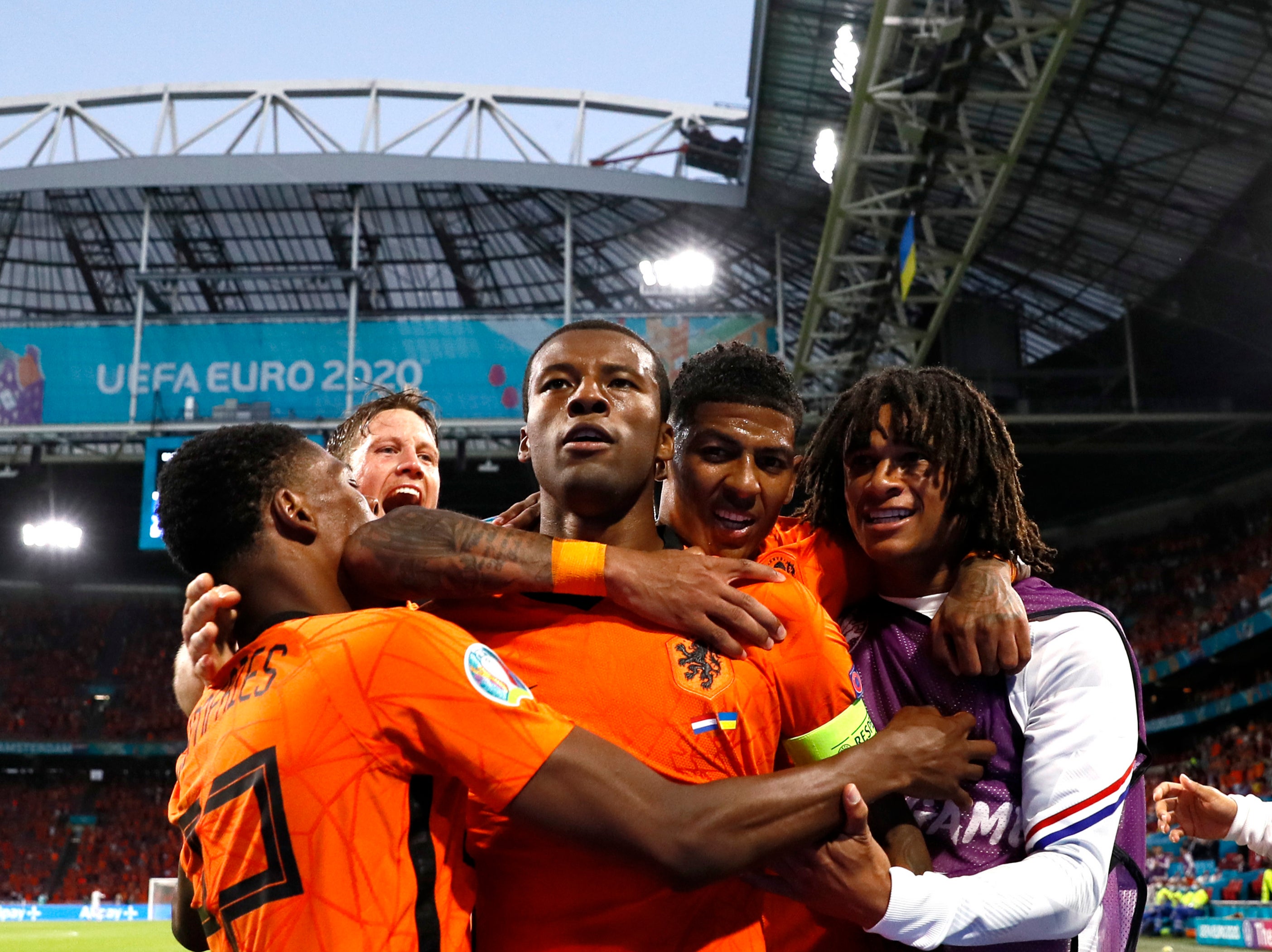 Netherlands players celebrate with captain and goalscorer Georginio Wijnaldum (centre)