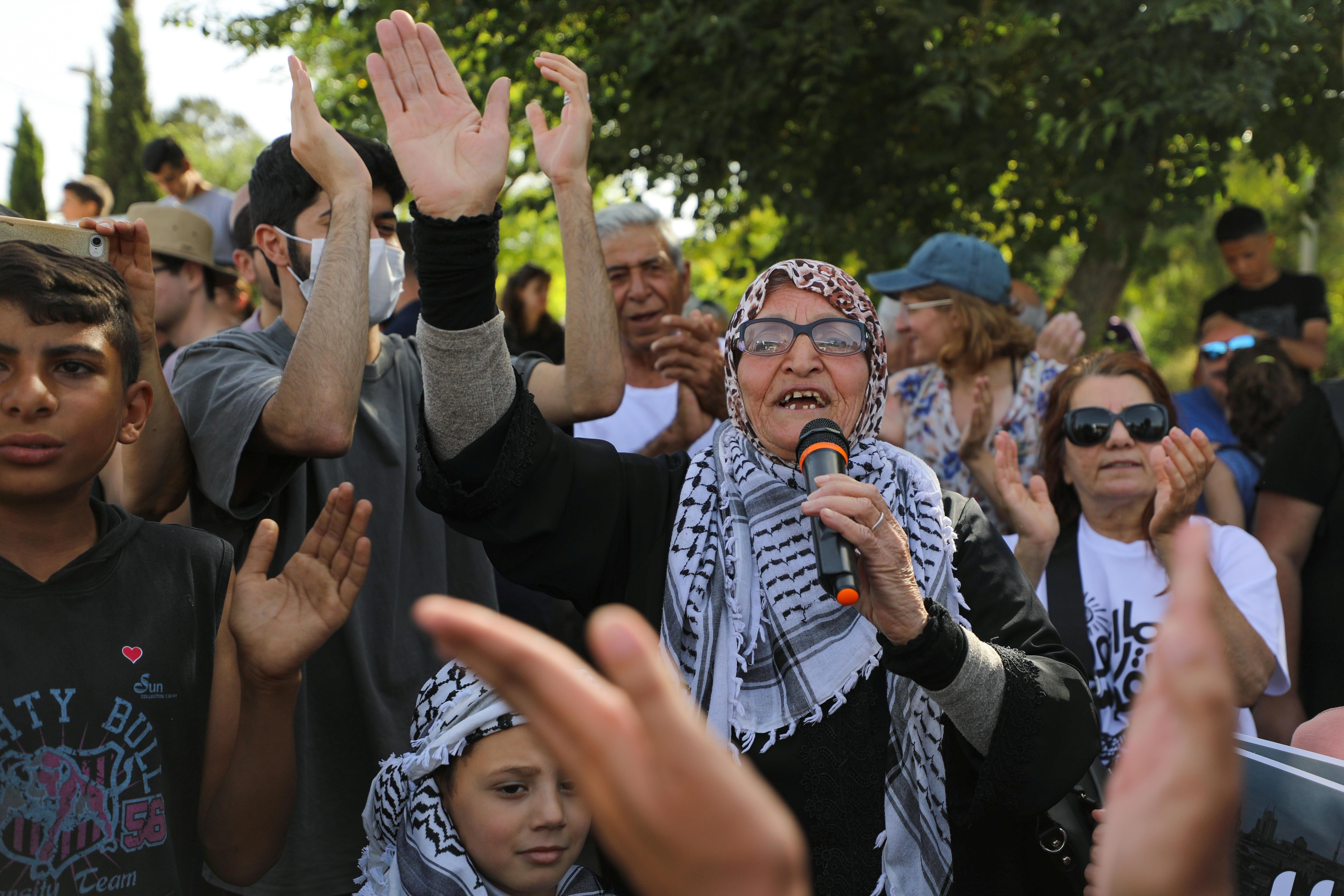 Protesters take part in a demonstration on 11 June against the proposed eviction of Palestinian families in Sheikh Jarrah