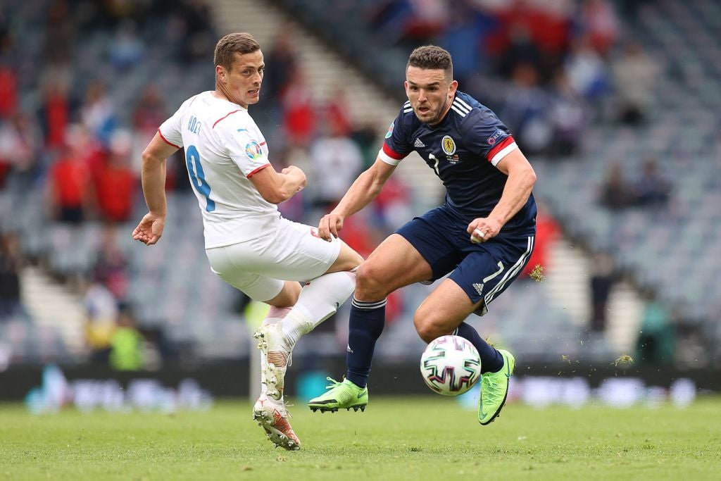 Czech Republic’s Tomas Holes vies with Scotland’s midfielder John McGinn