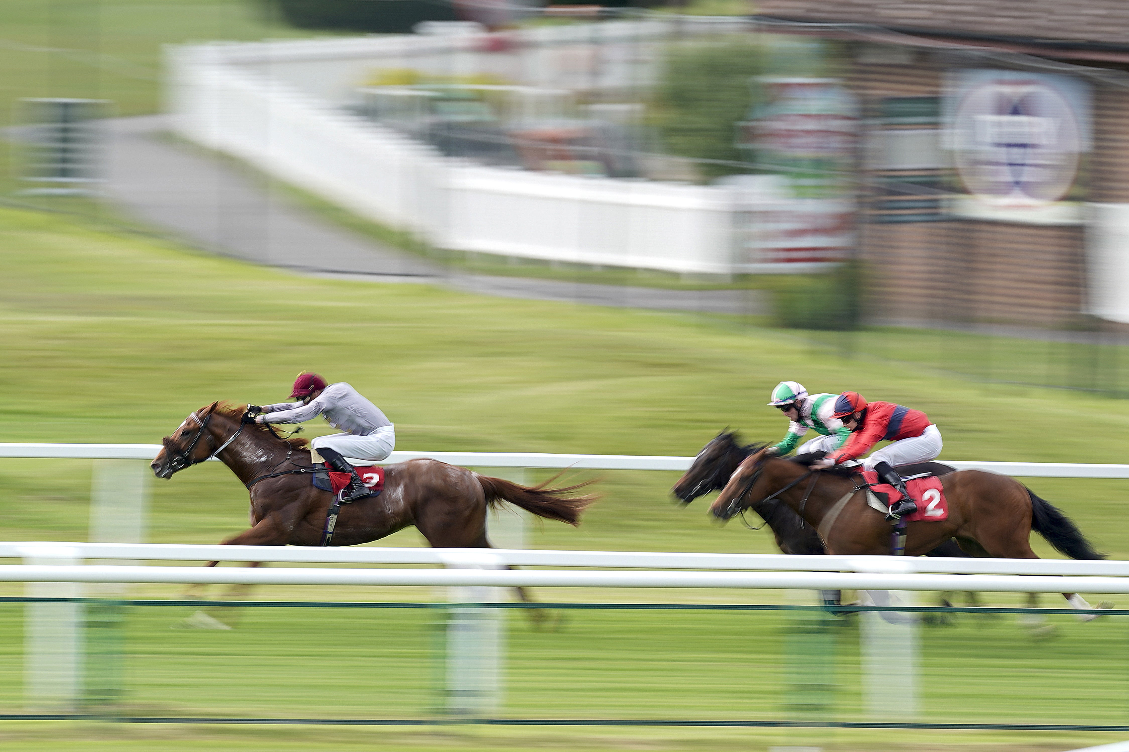 James Doyle riding Ebro River (left) coming home to win The Coral ‘Beaten By A Length’ National Stakes at Sandown Park Racecourse