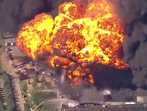 A fireball explodes out from a Chemtool plant in Rockton, Illinois, as firefighters battle the blaze