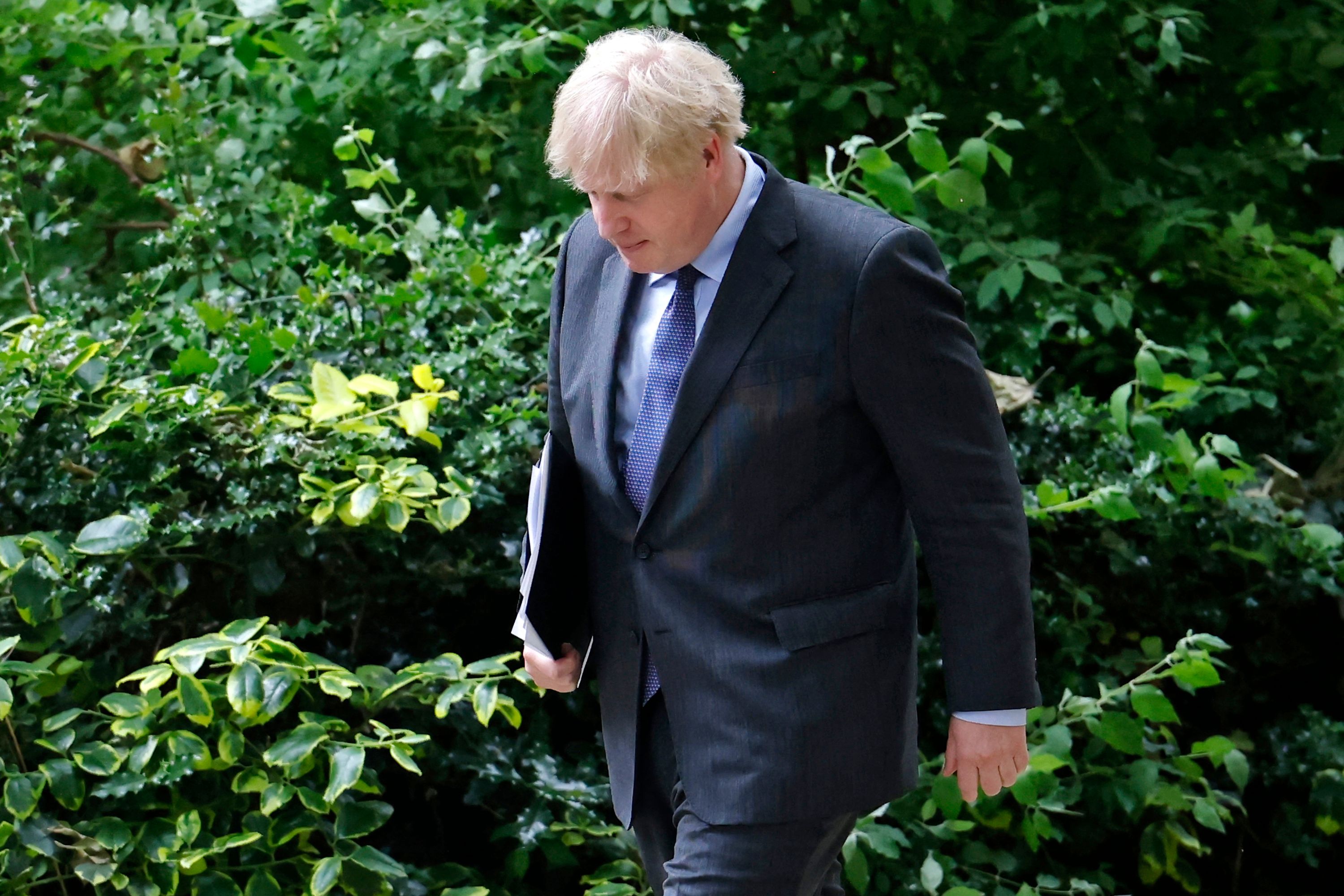 Boris Johnson returns to 10 Downing Street after giving an update on the coronavirus Covid-19 pandemic