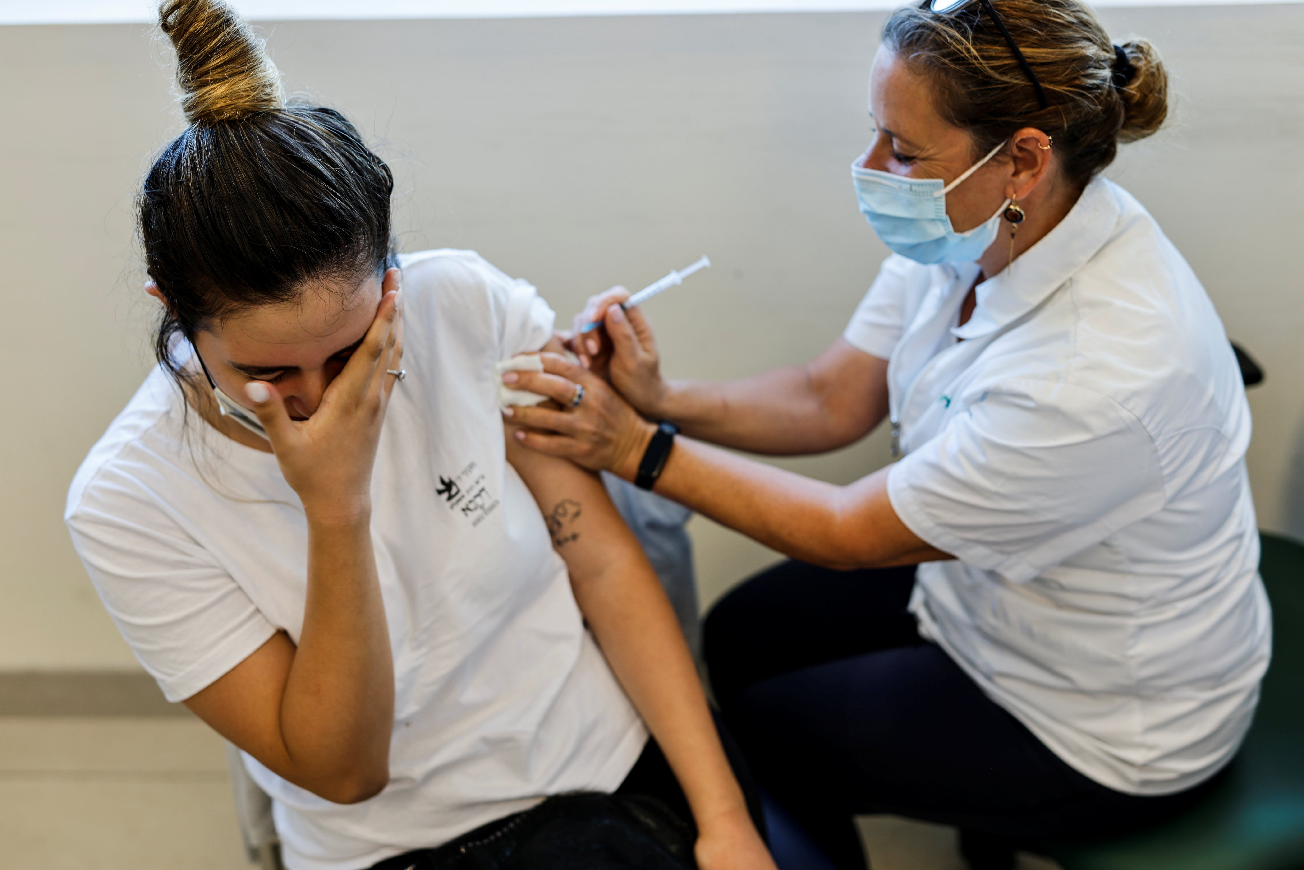 A teenager receives a dose of a Covid vaccine in Ashkelon, Israel