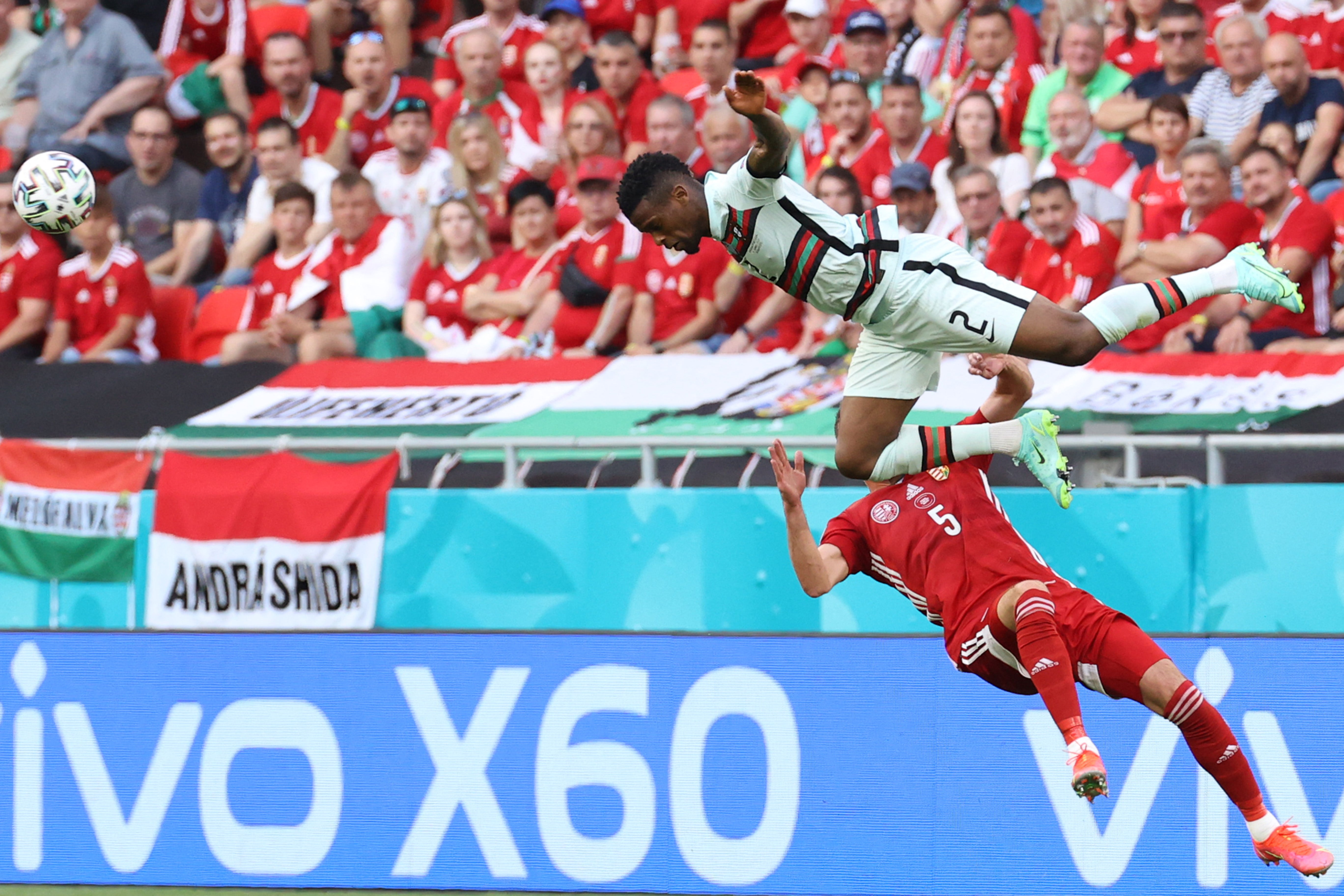 Portugal’s Nelson Semedo (top) challenges Attila Fiola