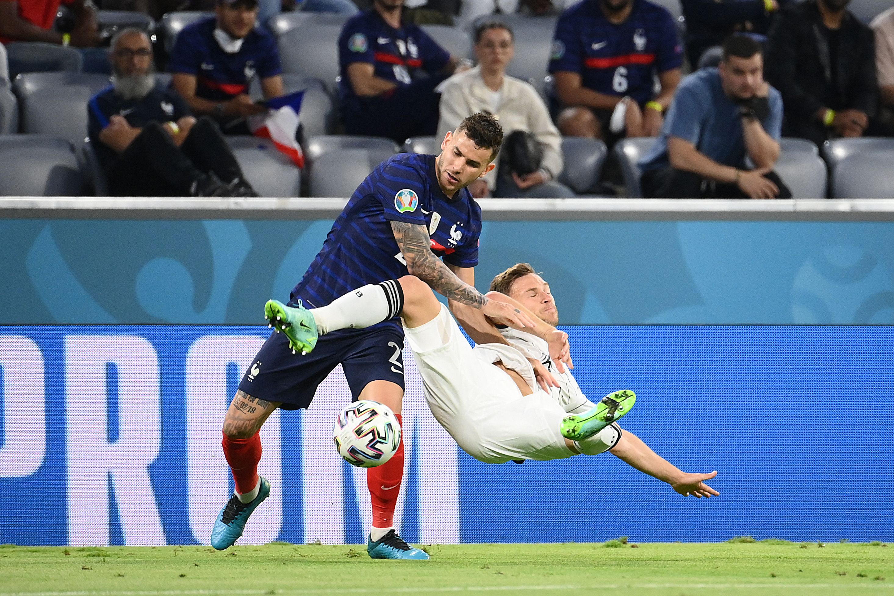 Joshua Kimmich is upended by Lucas Hernandez