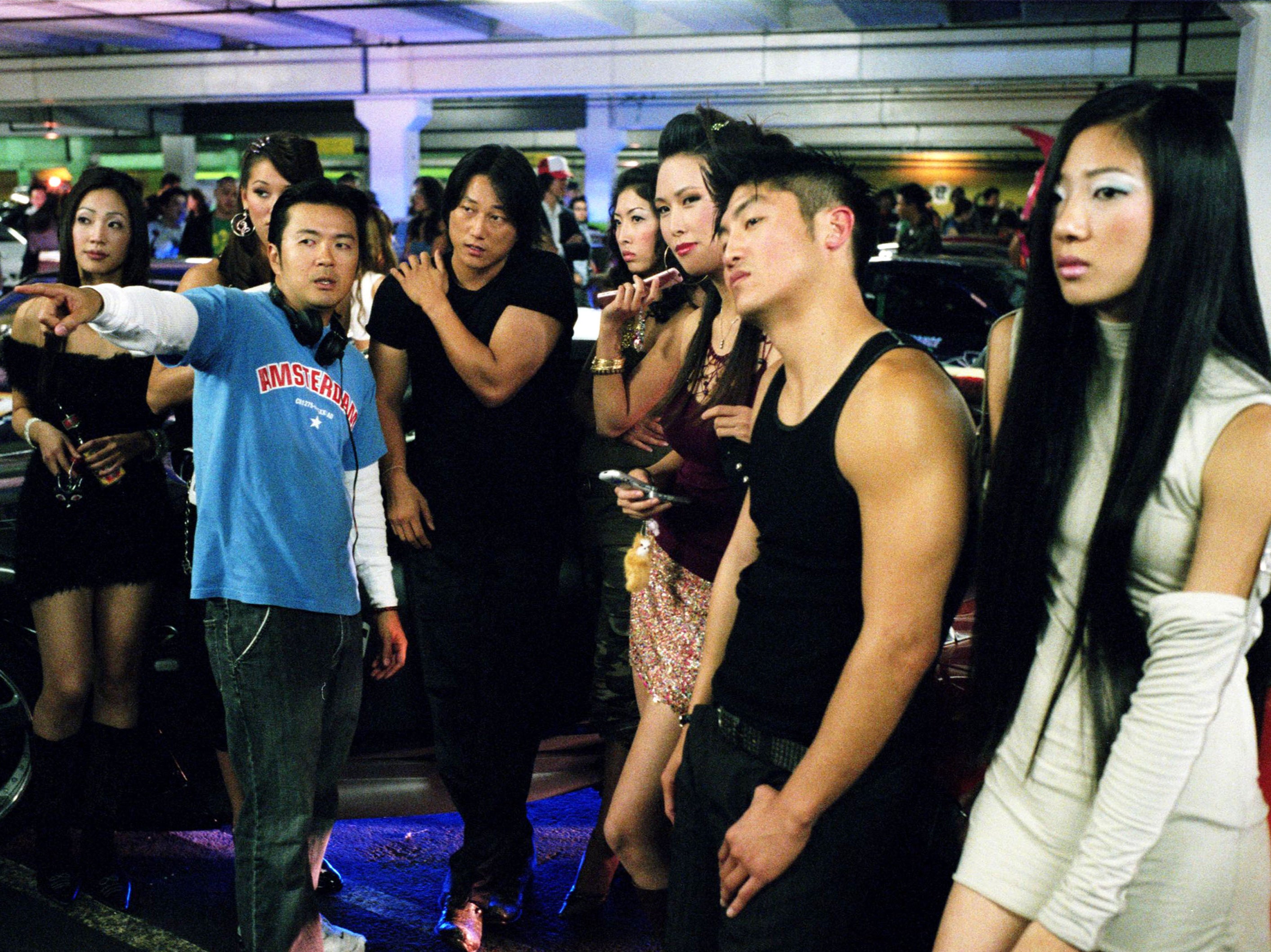 Justin Lin, Sung Kang, Brian Tee on the set of ‘Tokyo Drift’ in 2006