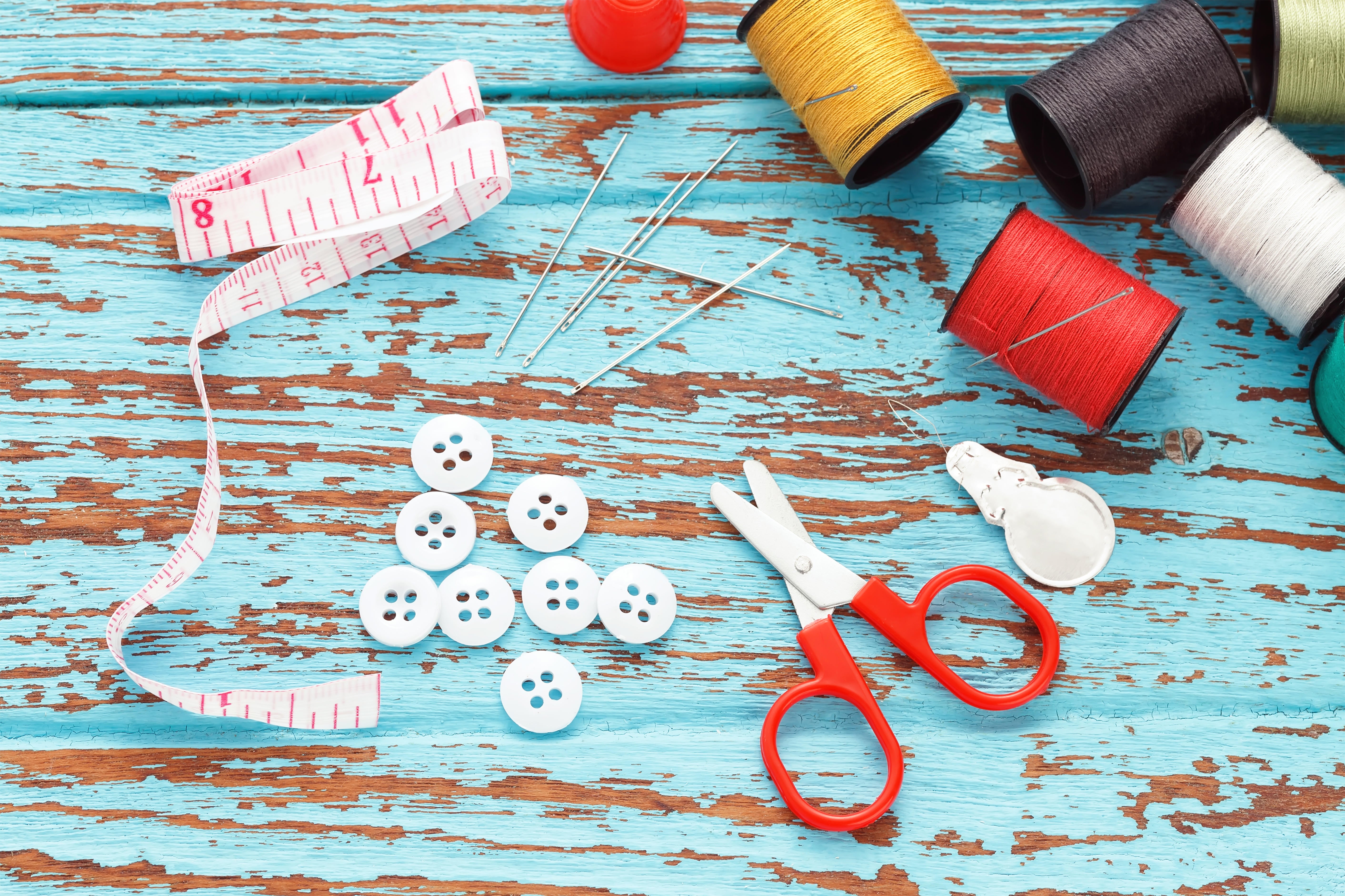 Scissors and sewing supplies laid out on a table