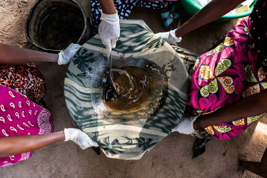 The oil mixture is filtered using cloth