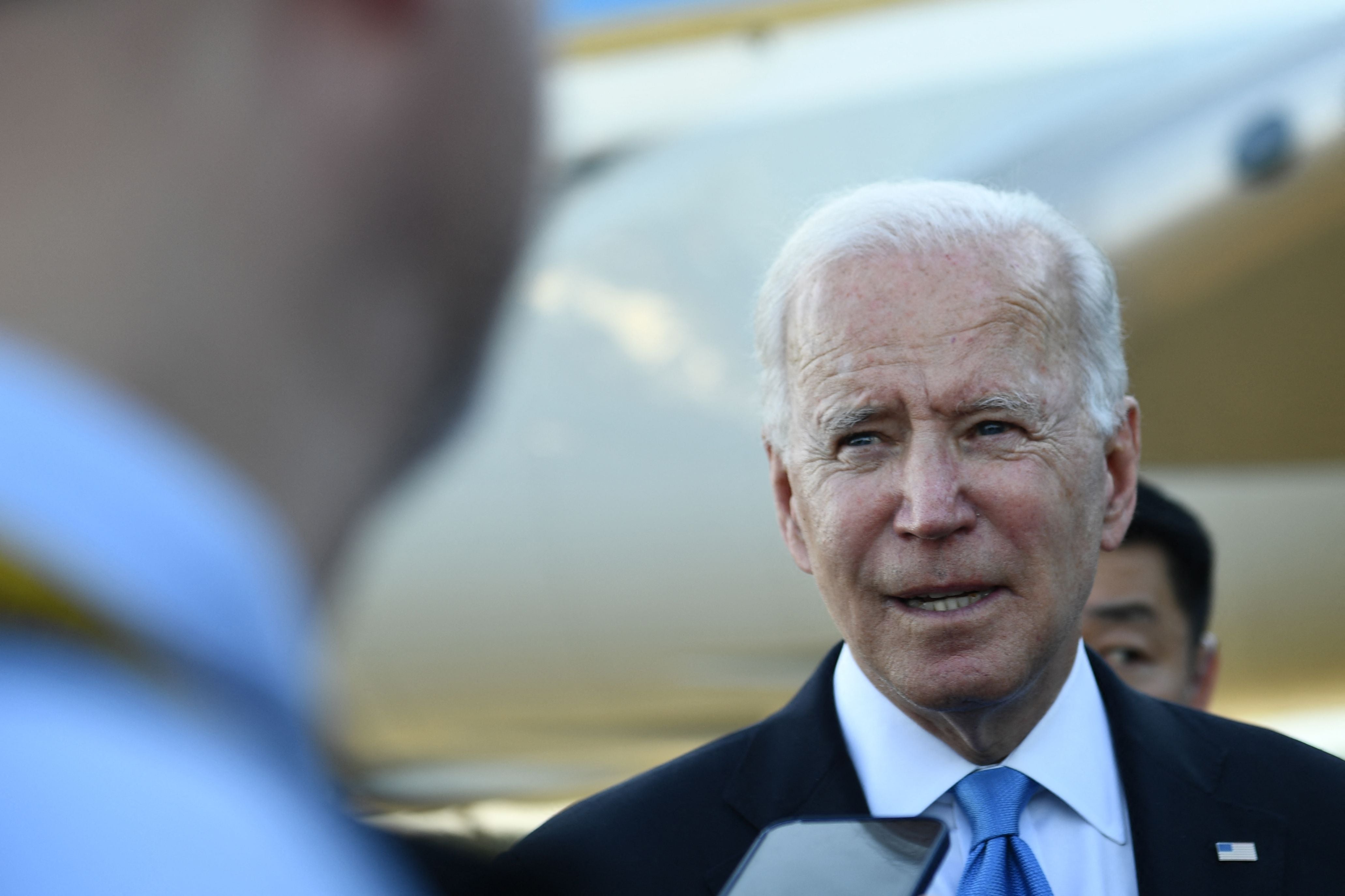 US President Joe Biden speaks with press, preparing departing the airport, after the US-Russia summit in Geneva on June 16, 2021.