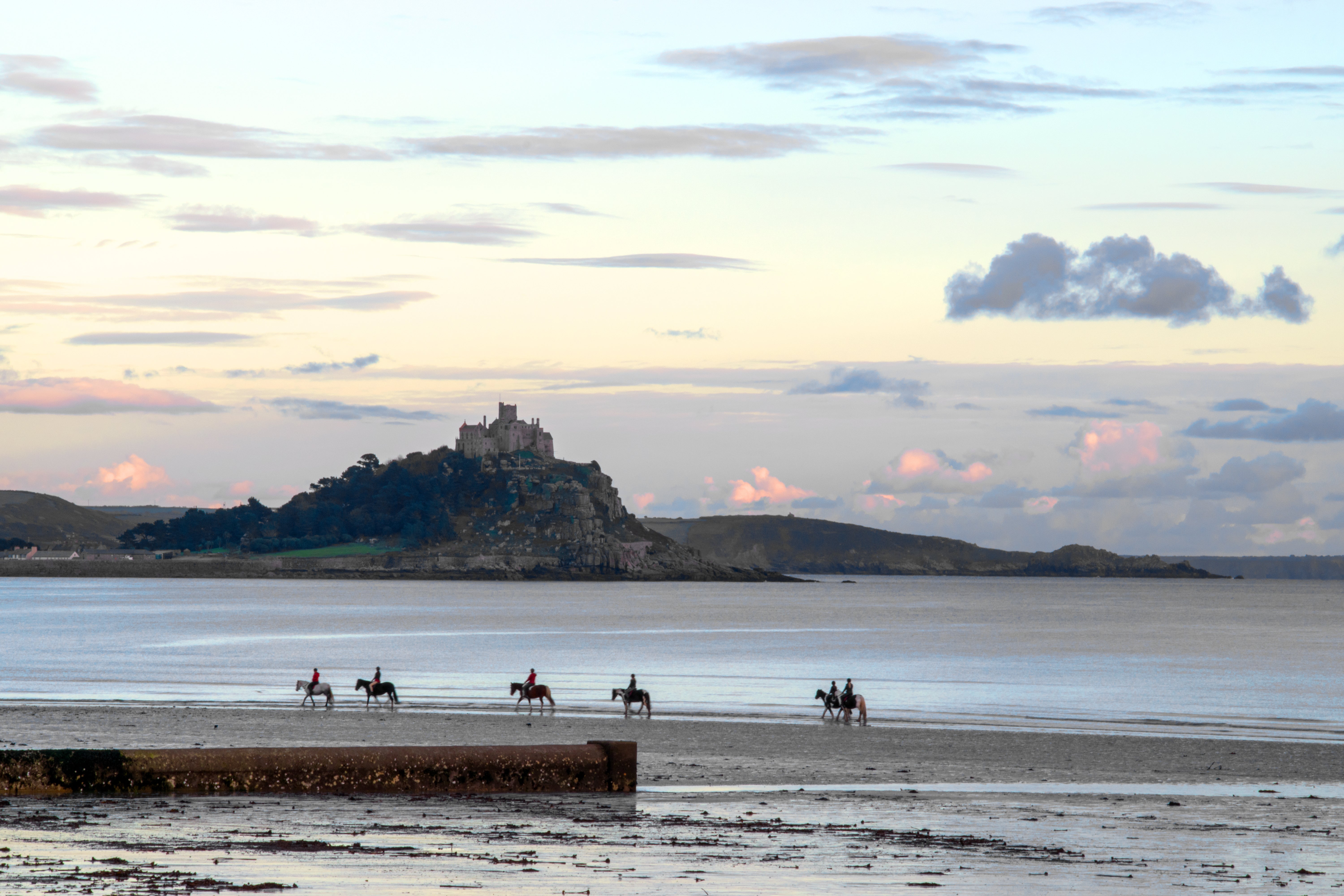 Horse-riding along a Cornish beach with St Michael’s Mount in the distance