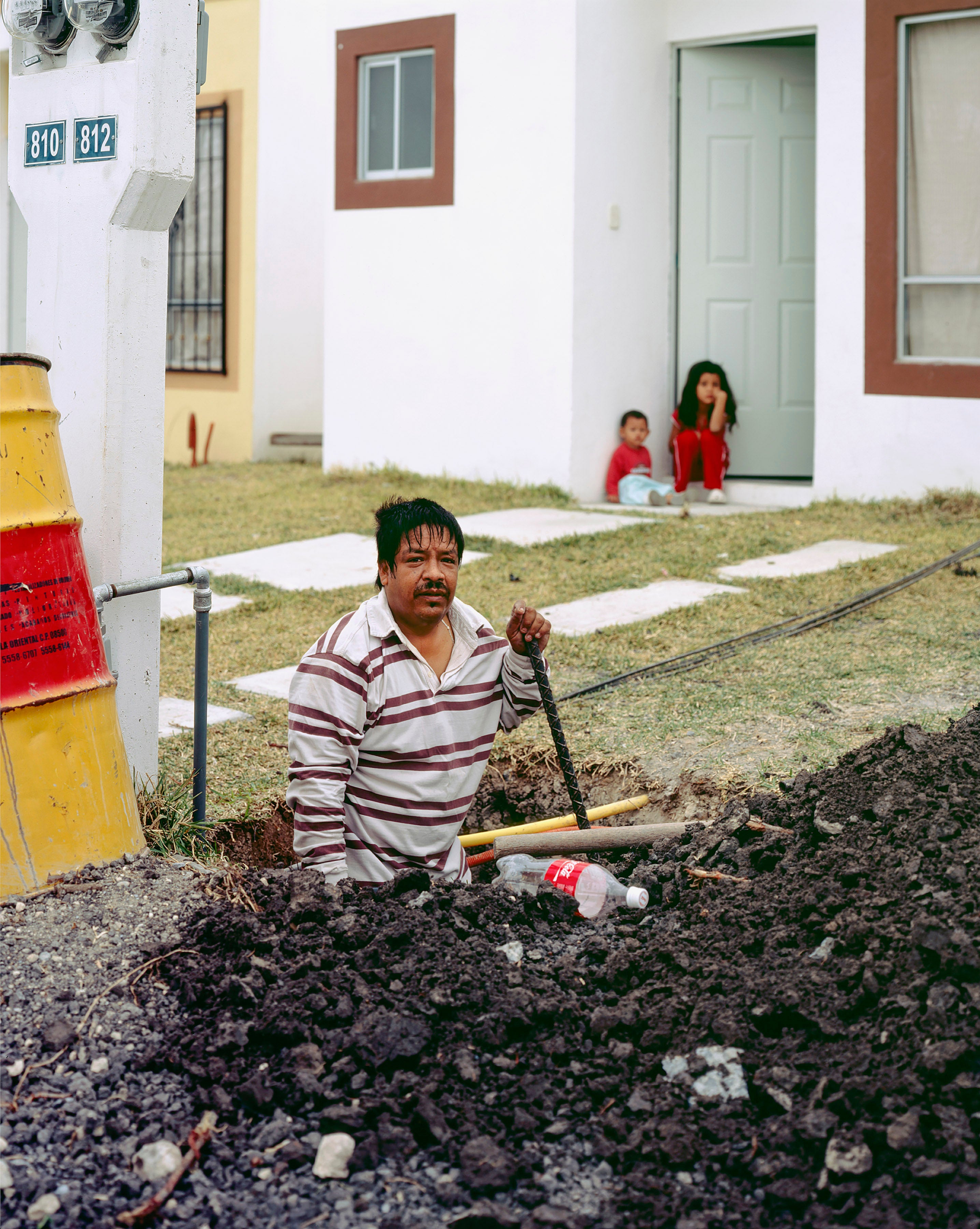 Man digging a hole from A Small Guide to Homeownership, 2020, by Alejandro Cartagena Escobedo