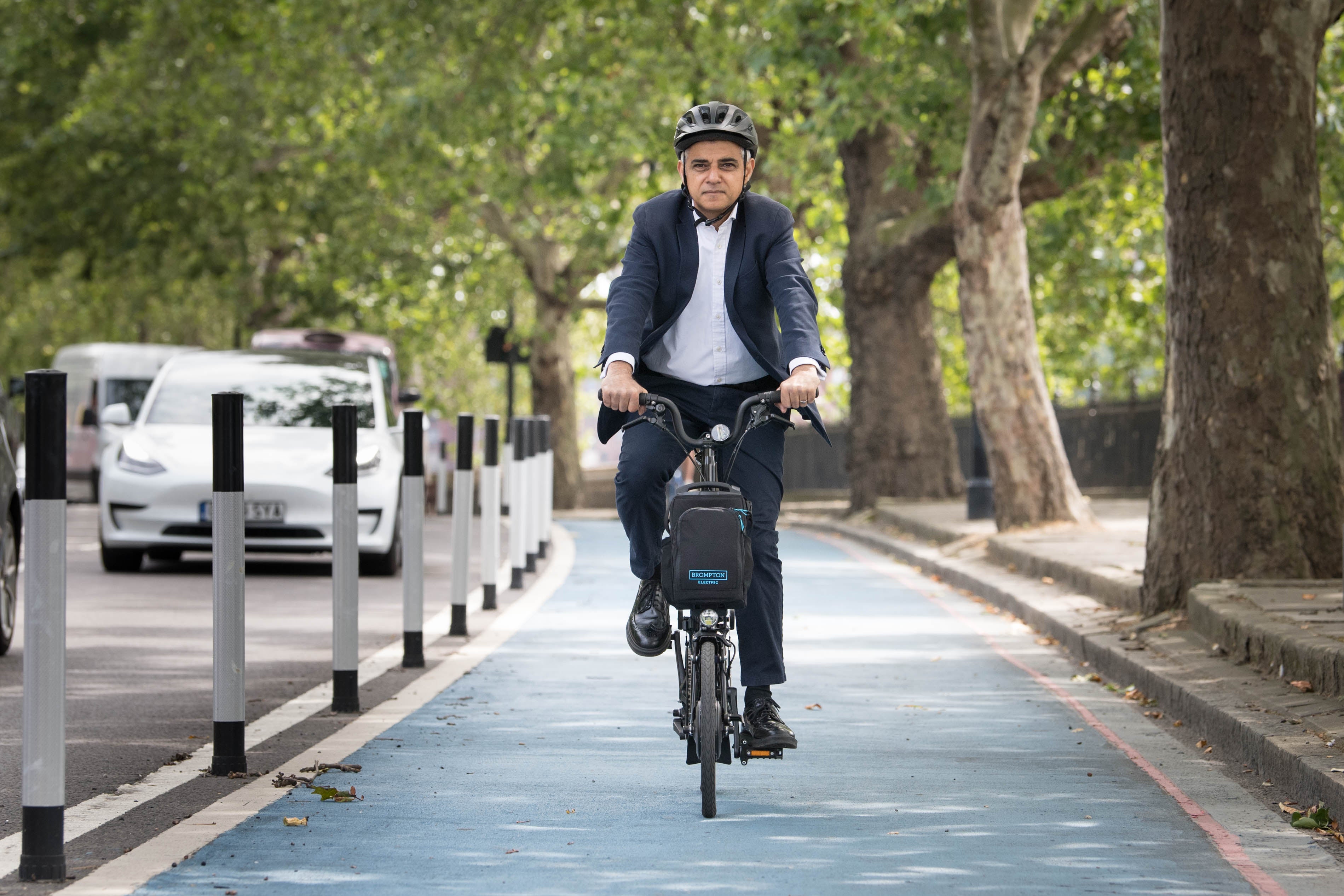 Mayor of London Sadiq Khan cycles down a new Streetspace bike lane in London on 23 July 2020