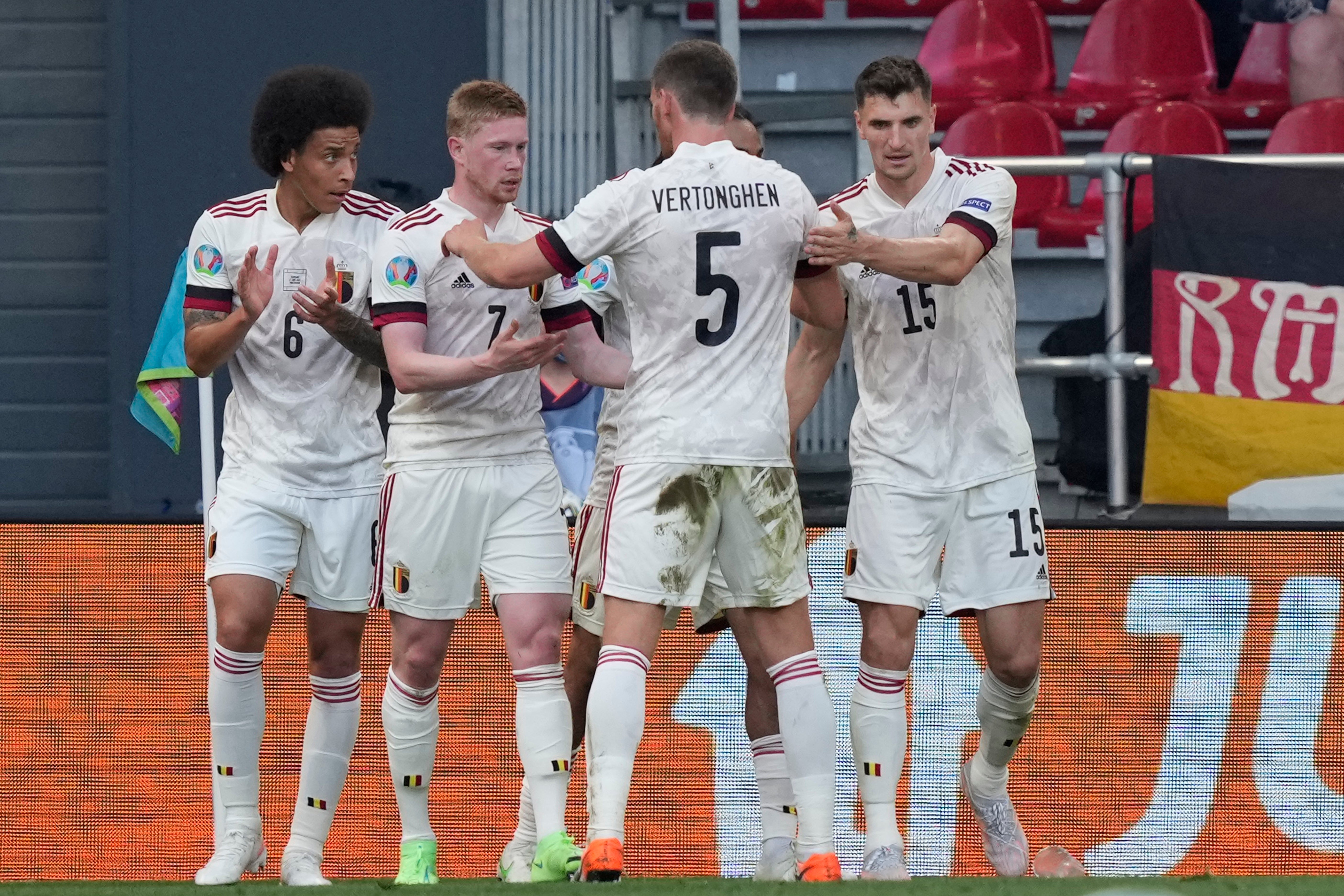 Kevin De Bruyne (second left) celebrates after firing Belgium to victory over Denmark