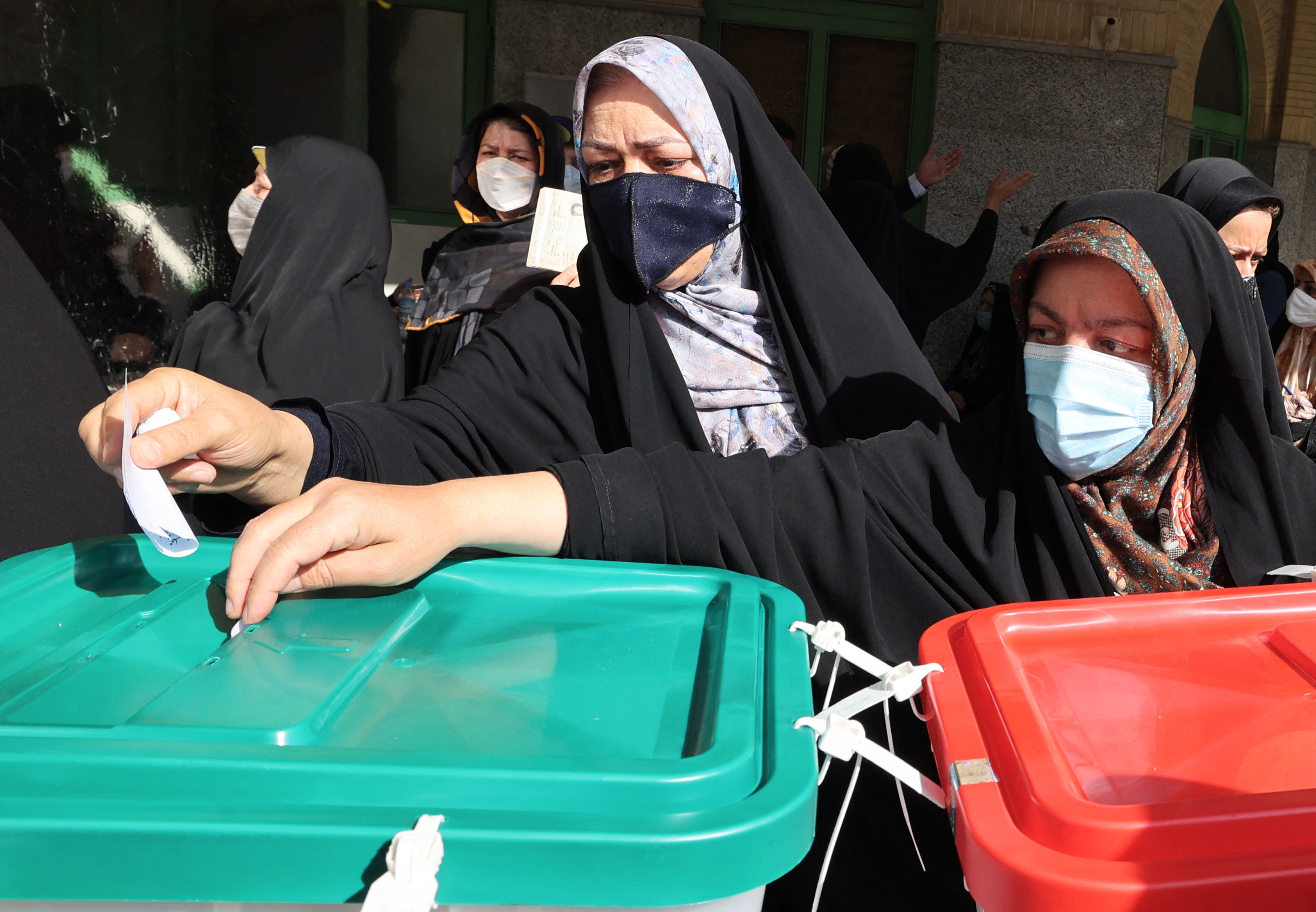 Iranian women cast their ballots for presidential election at a polling station in Tehran