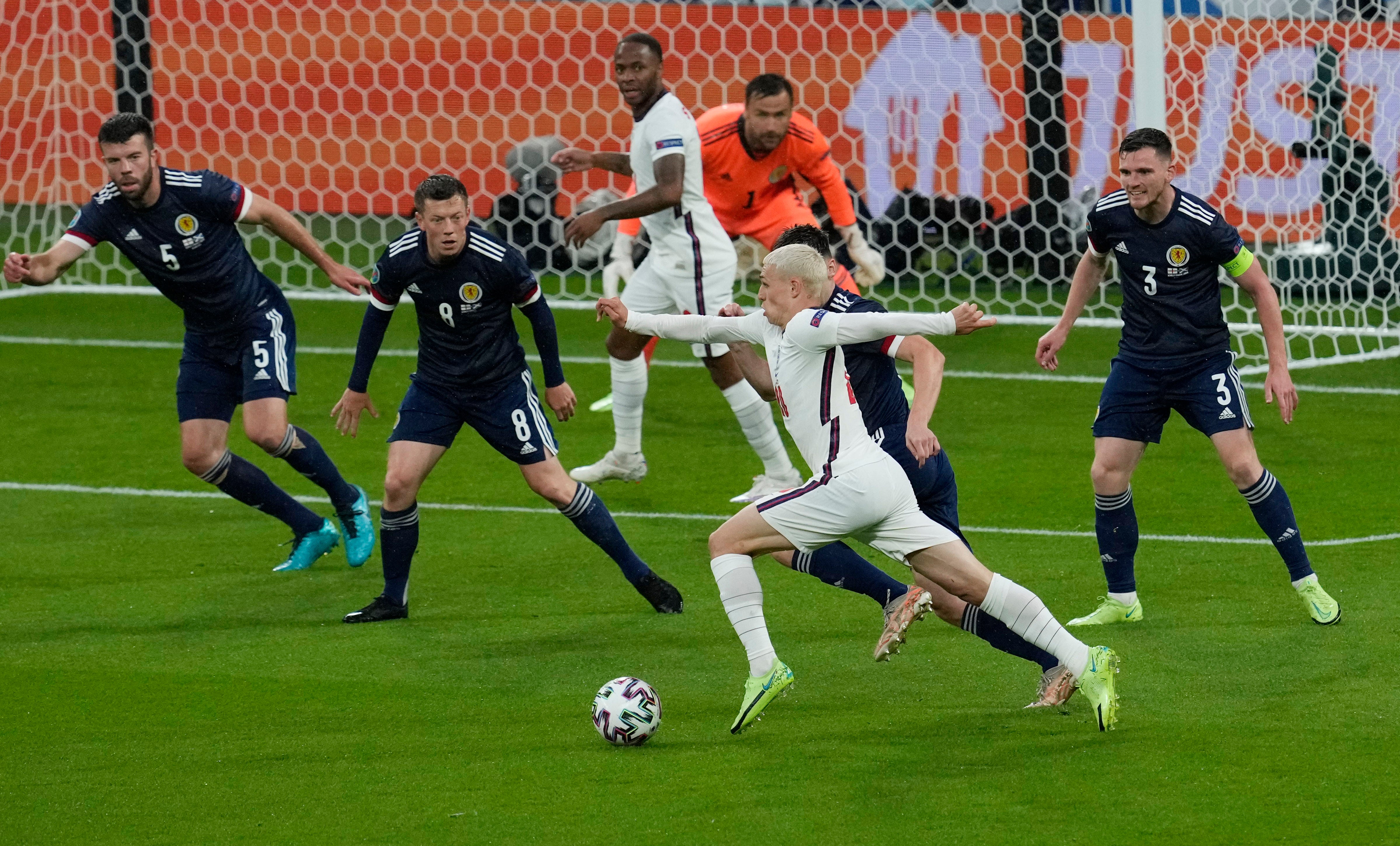 Phil Foden runs at the Scotland goal