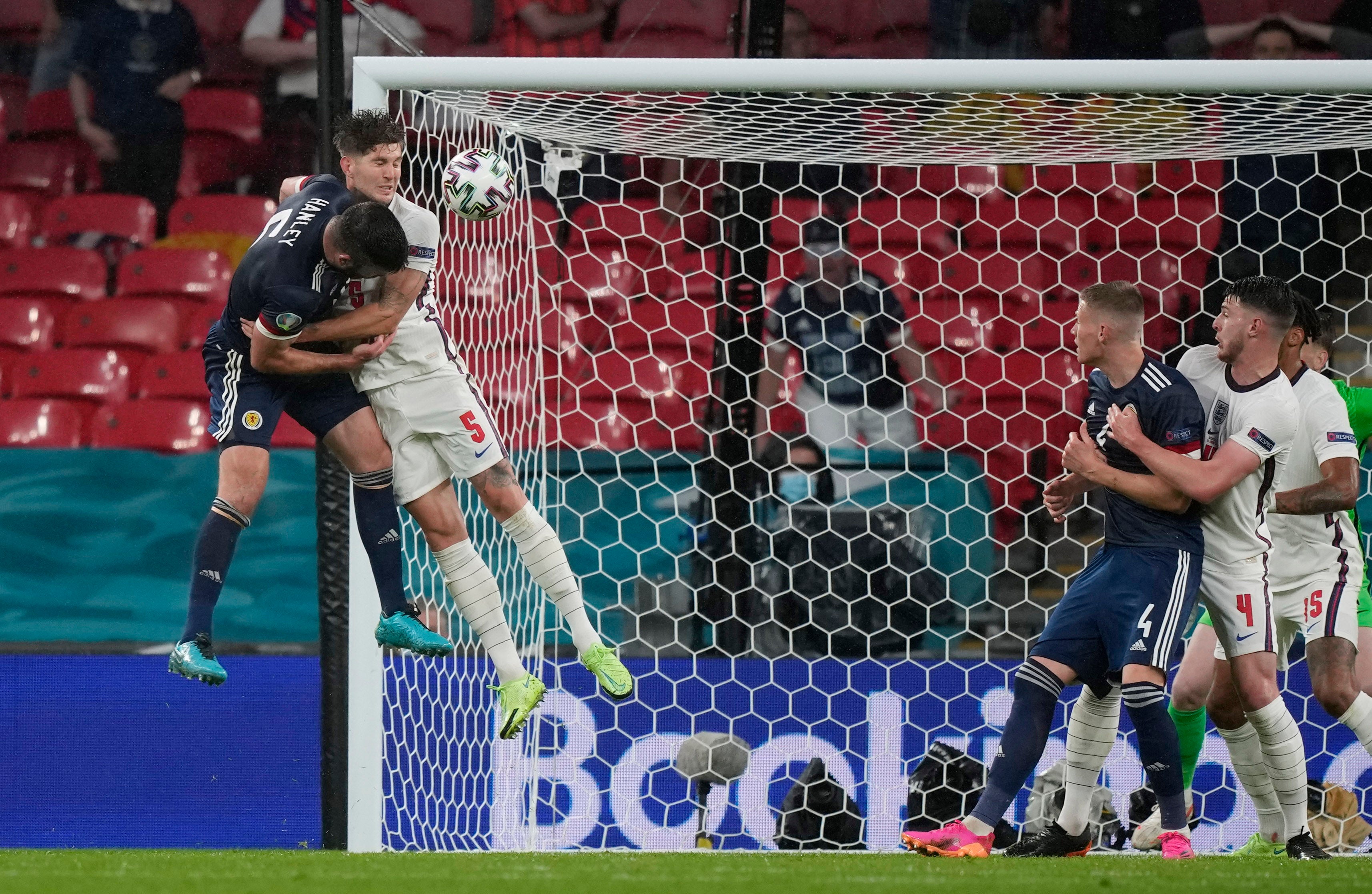 John Stones goes up for the ball with Grant Hanley