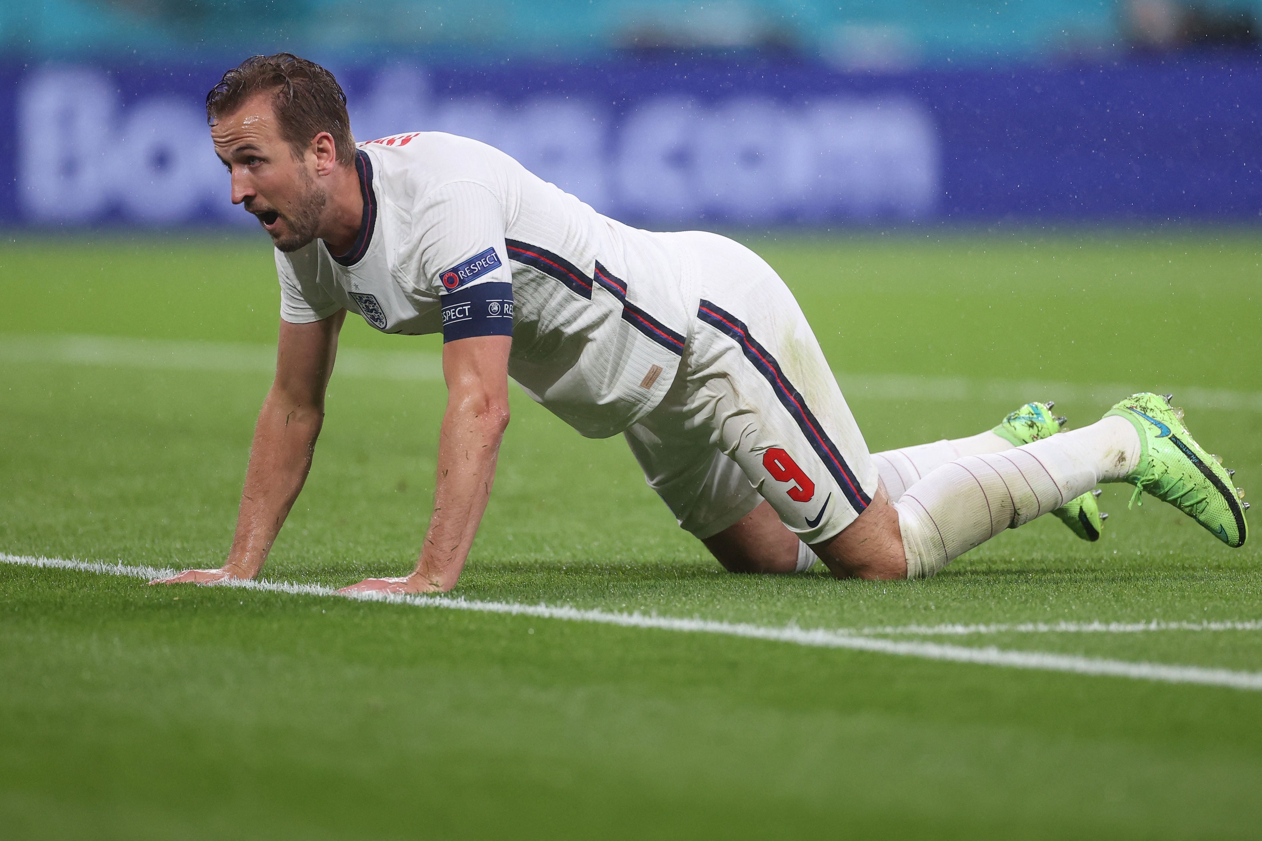 Harry Kane falls to the ground against Scotland