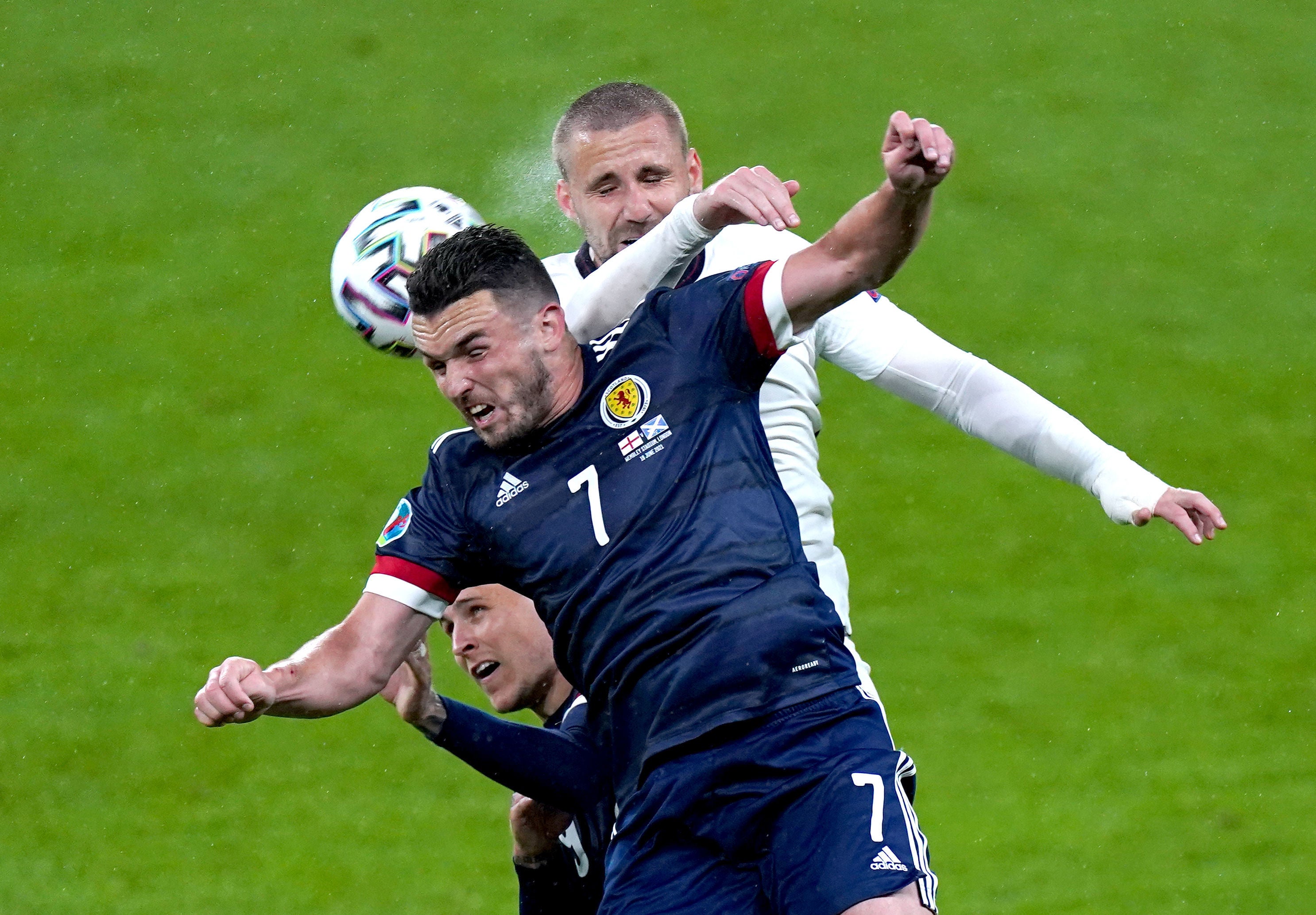 John McGinn and Luke Shaw battle for the ball