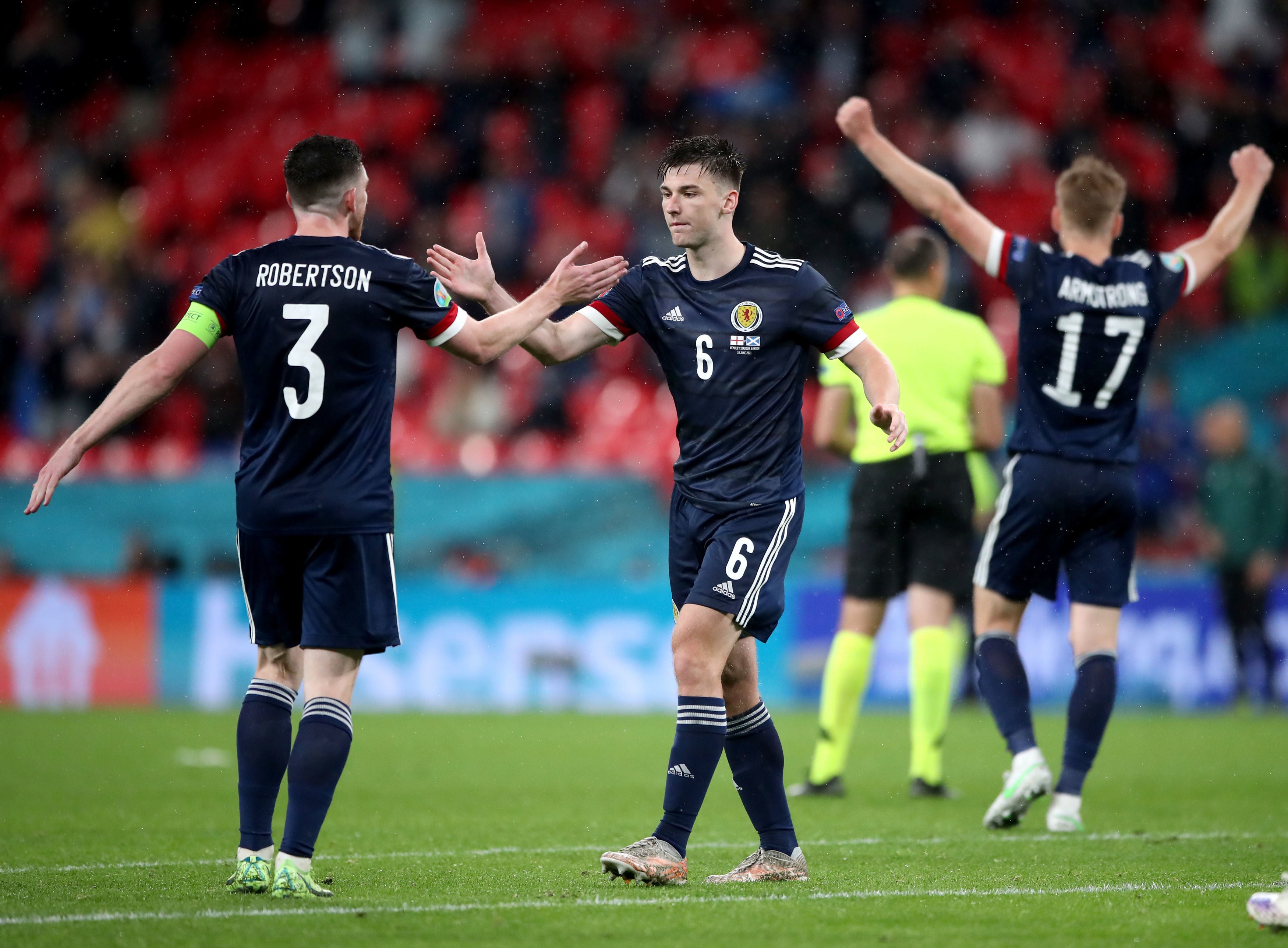 Andrew Robertson and Kieran Tierney react after the match