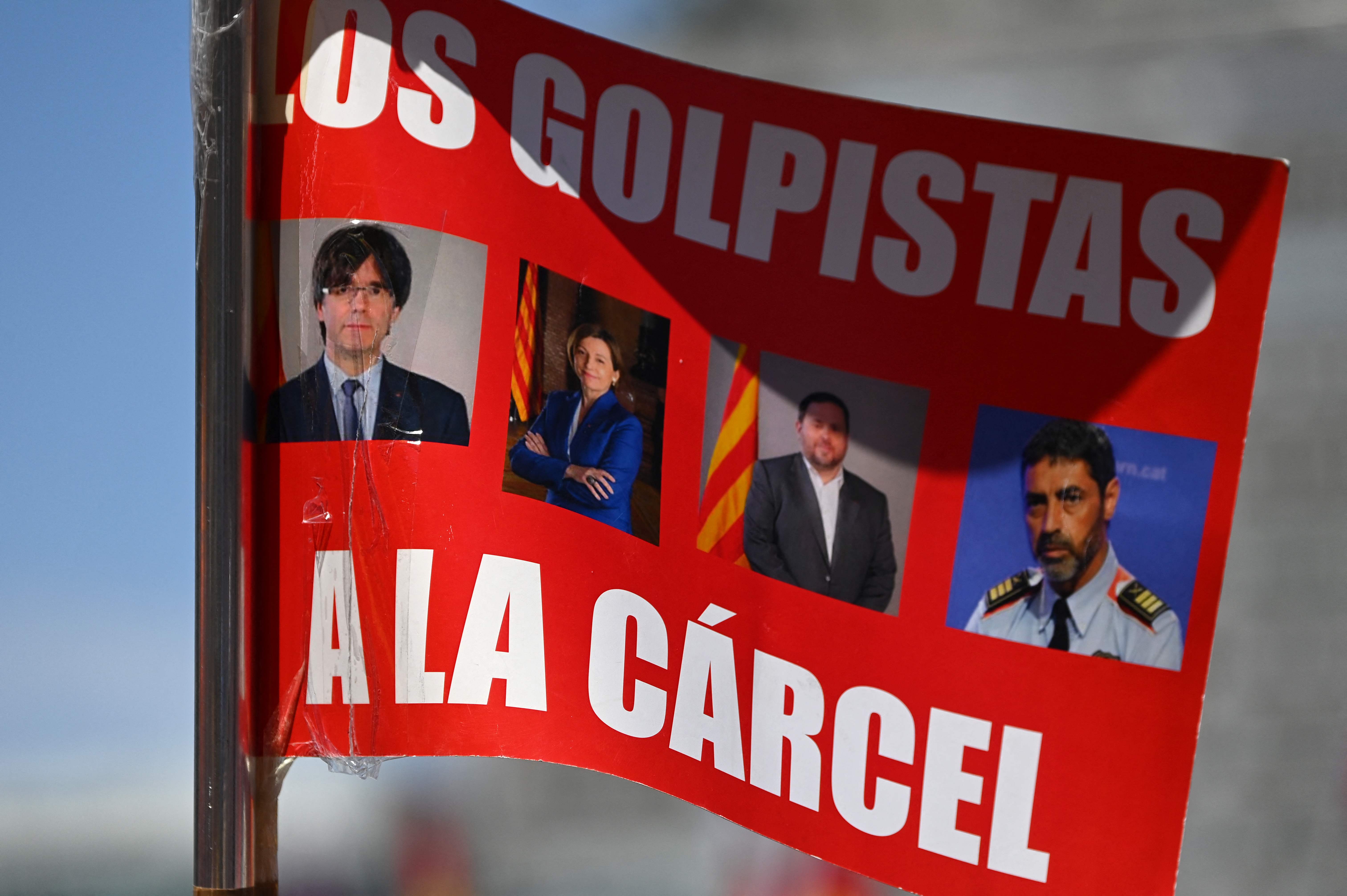 A placard depicting Catalan leaders Carles Puigdemont, Carme Forcadell, Oriol Junqueras and former head of Catalonia's police force, Josep Lluis Trapero, reading ‘To jail’