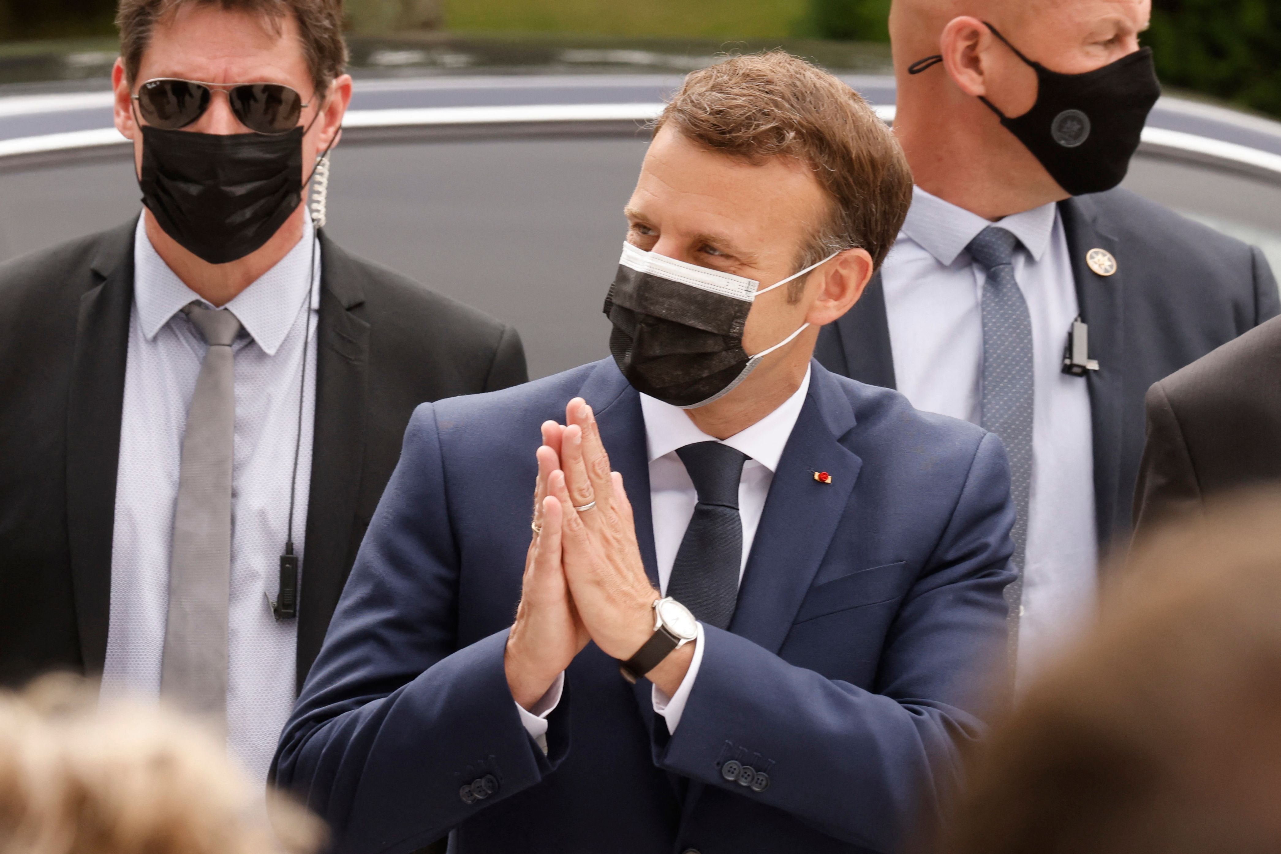 The French president, Emmanuel Macron, casts his vote at a polling station in Le Touquet on Sunday in the first round of the French regional elections