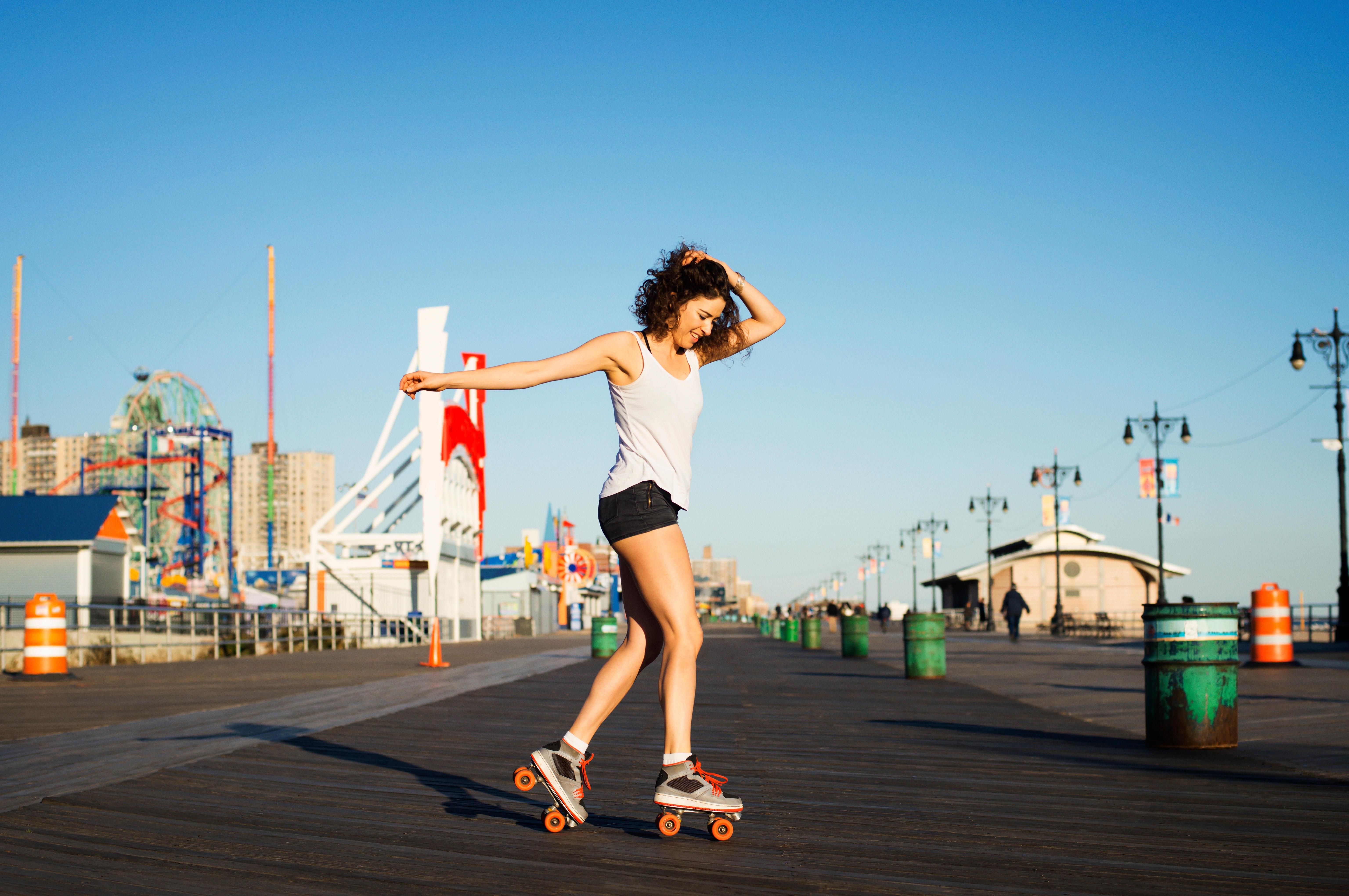 Woman rollerskating on promenade