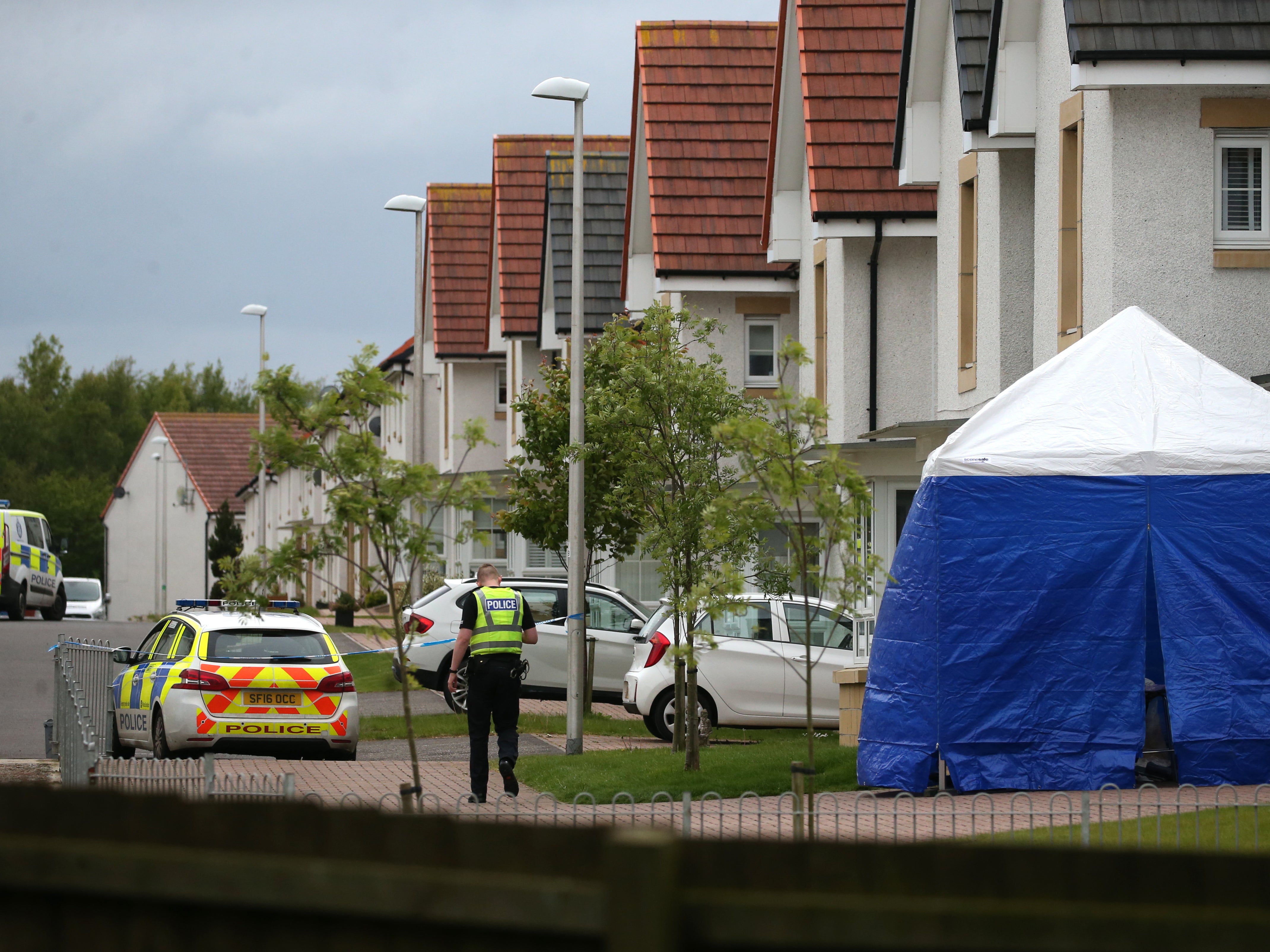 Police and forensic officers outside 61 Fairfeild Park, Monkton, Ayrshire, where Faulds from Kilmarnock was last seen alive