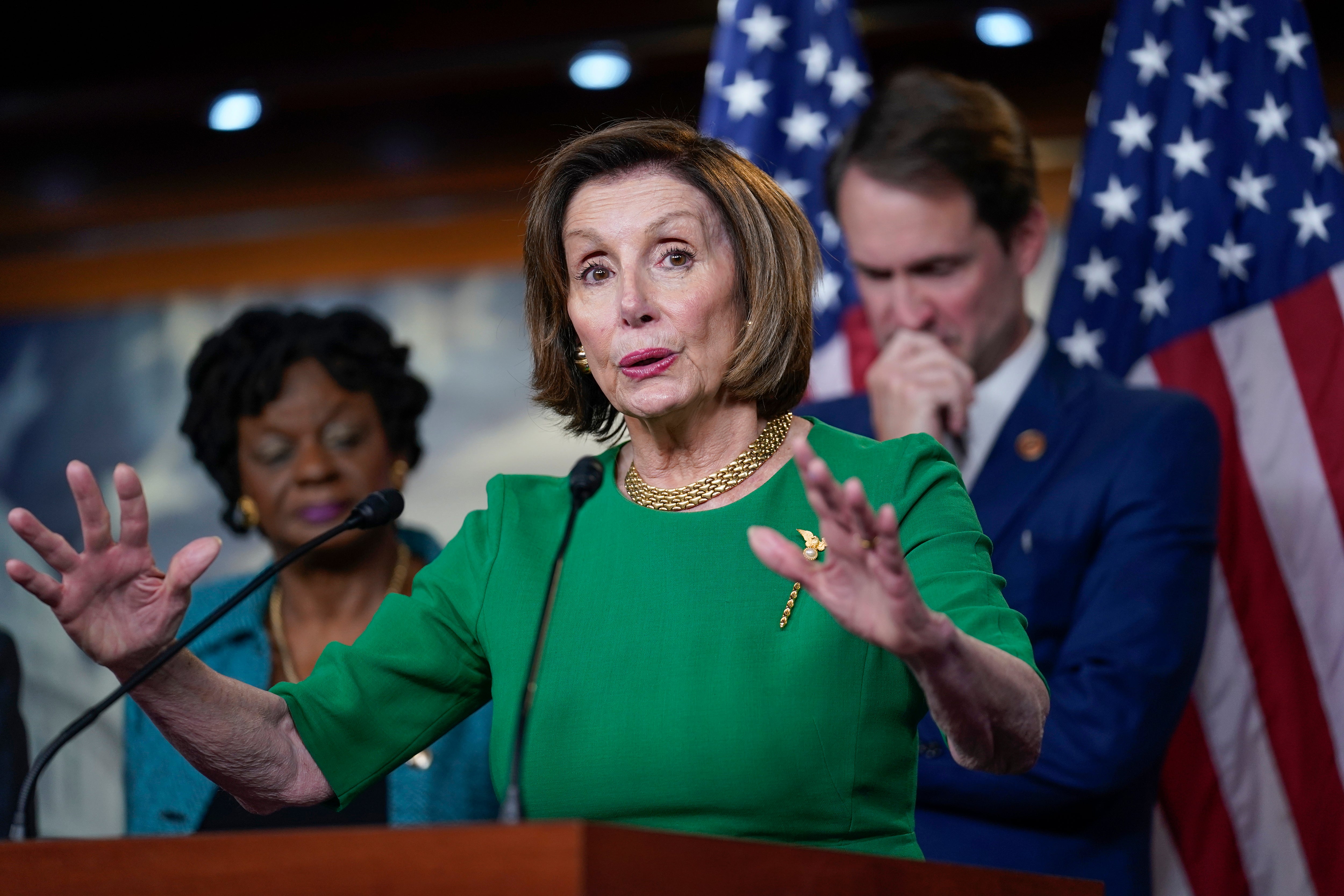 Nancy Pelosi speaks to reporters at the Capitol.