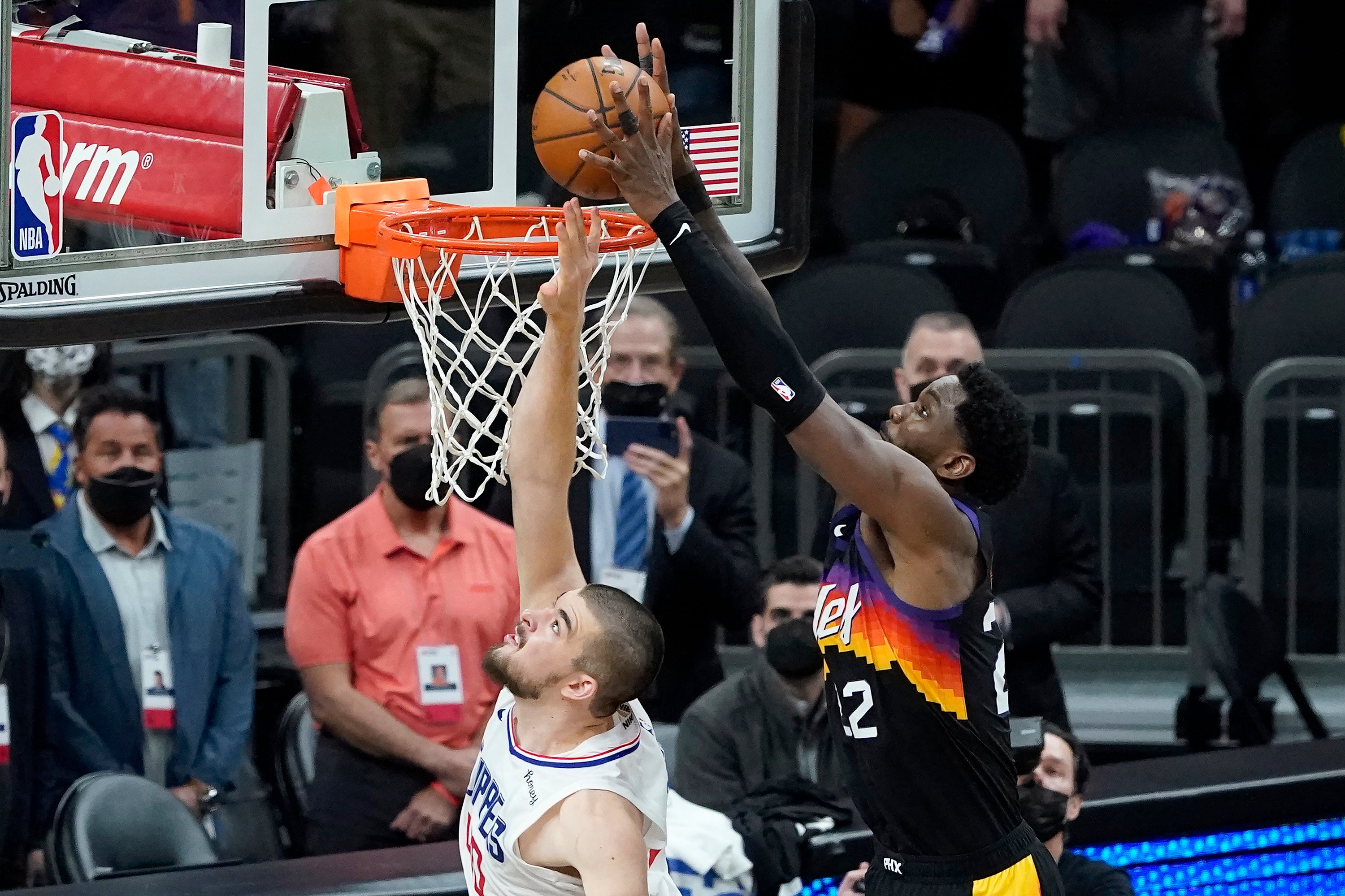 Phoenix Suns centre Deandre Ayton, right, scores over Los Angeles Clippers centre Ivica Zubac