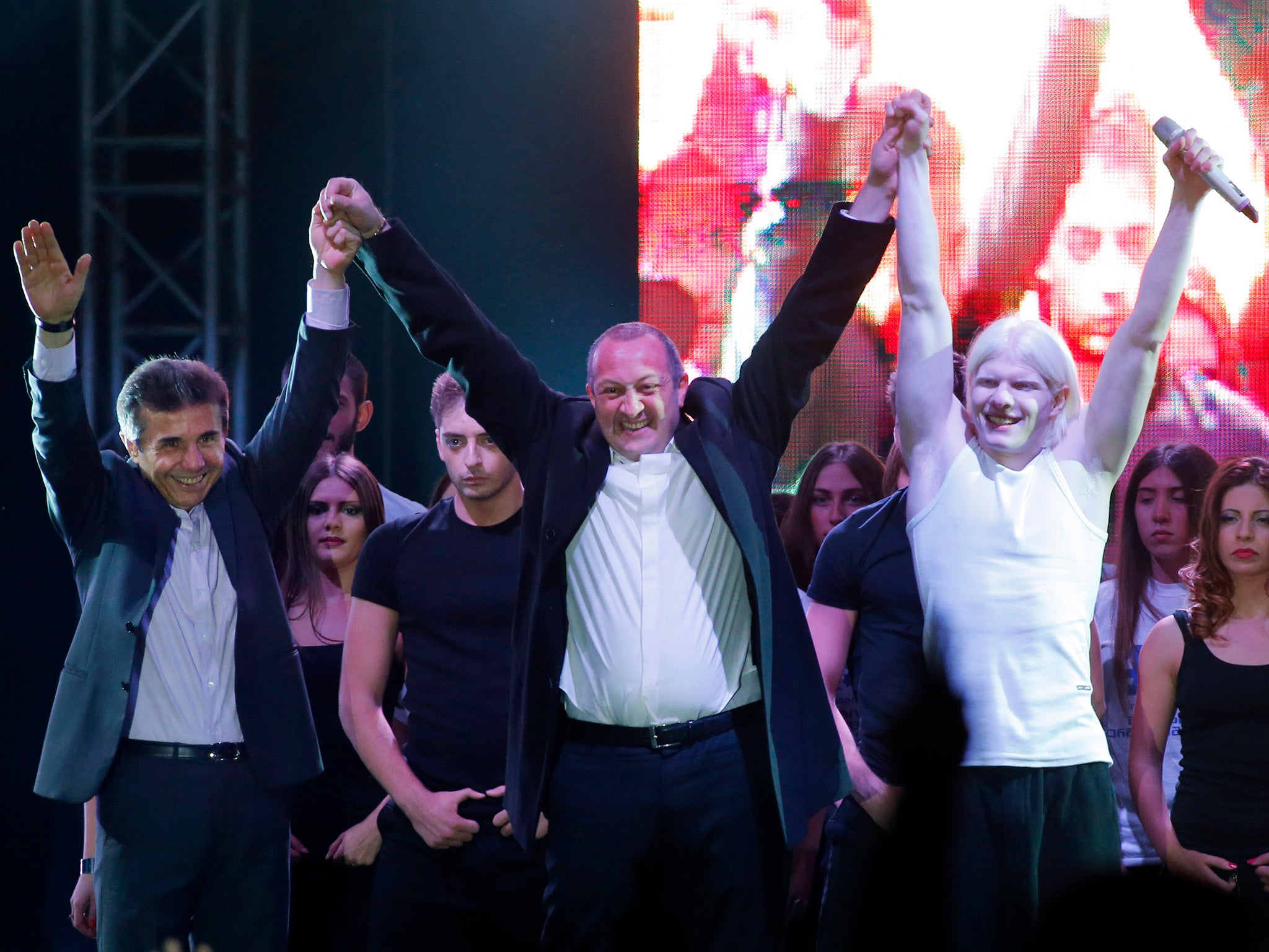 Bera (R) and his father (L) with then presidential candidate Georgy Margvelashvili, at a pre-election concert in 2013