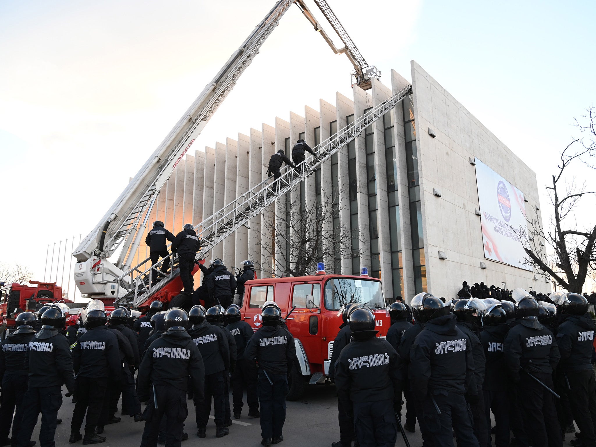 Police raiding the headquarters of the UNM in February this year