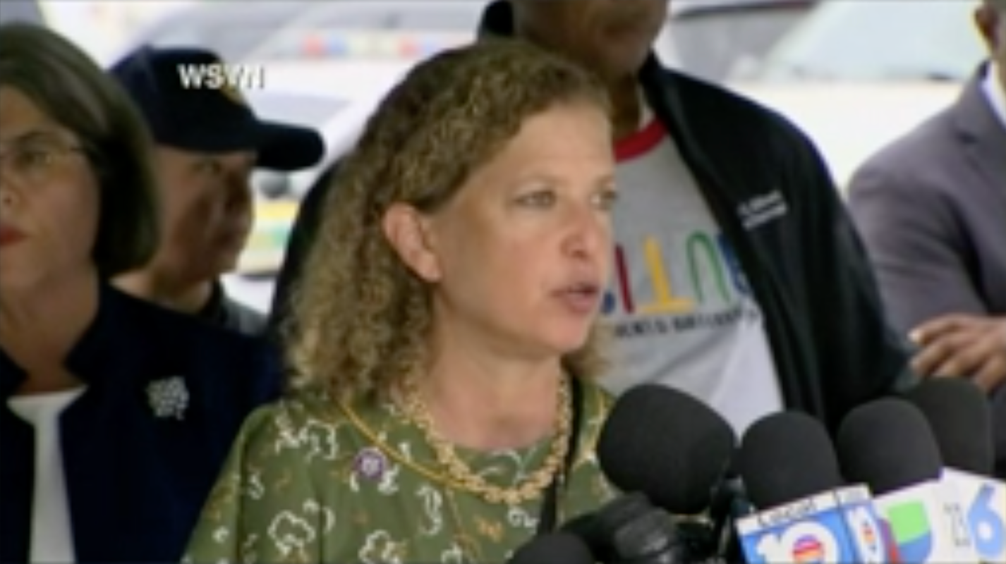 Rep Debbie Wasserman Schultz speaks to reporters after visiting the site where a Miami residential building collapsed