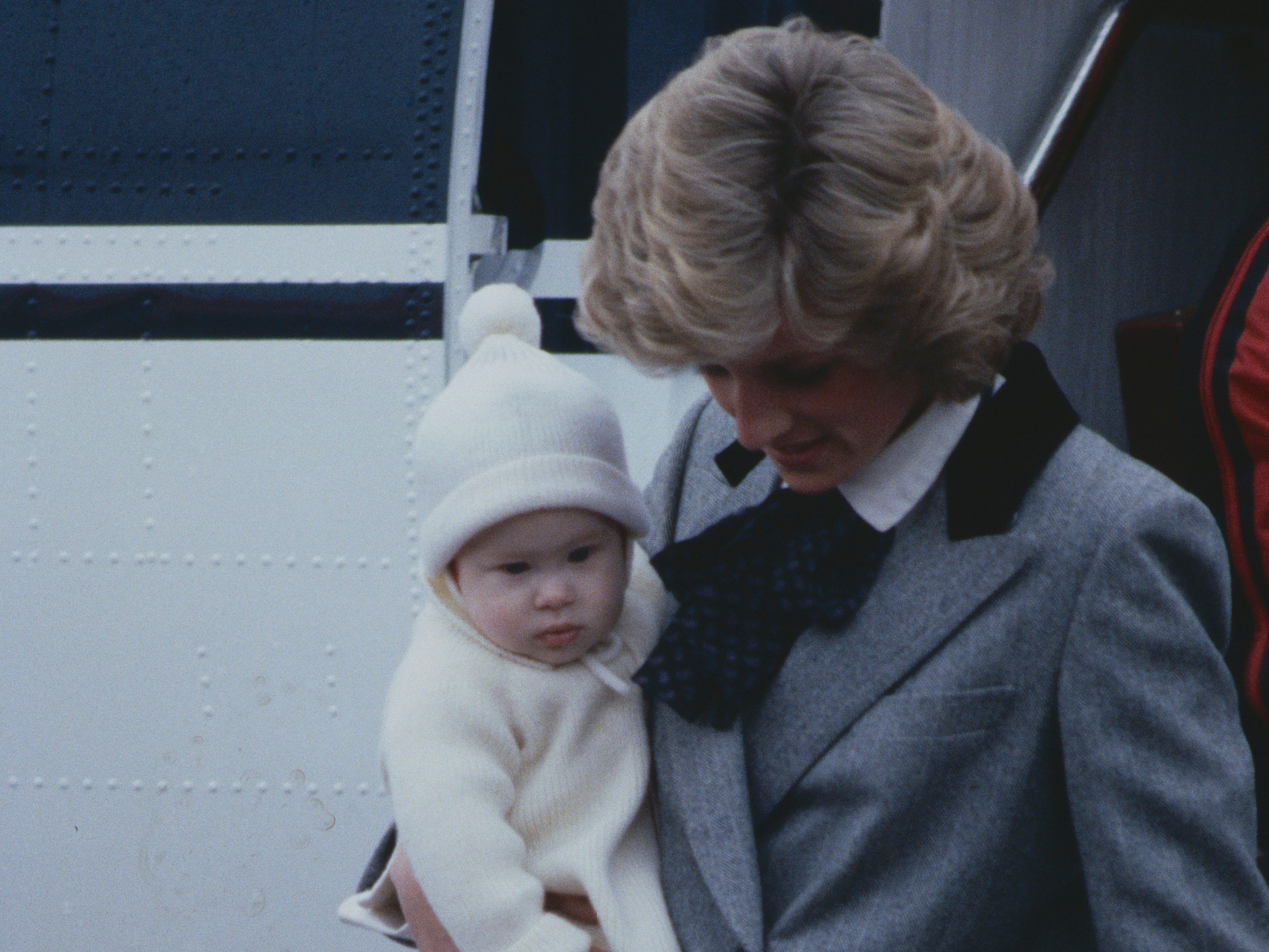 Princess Diana with baby Prince Harry leaving an airplane