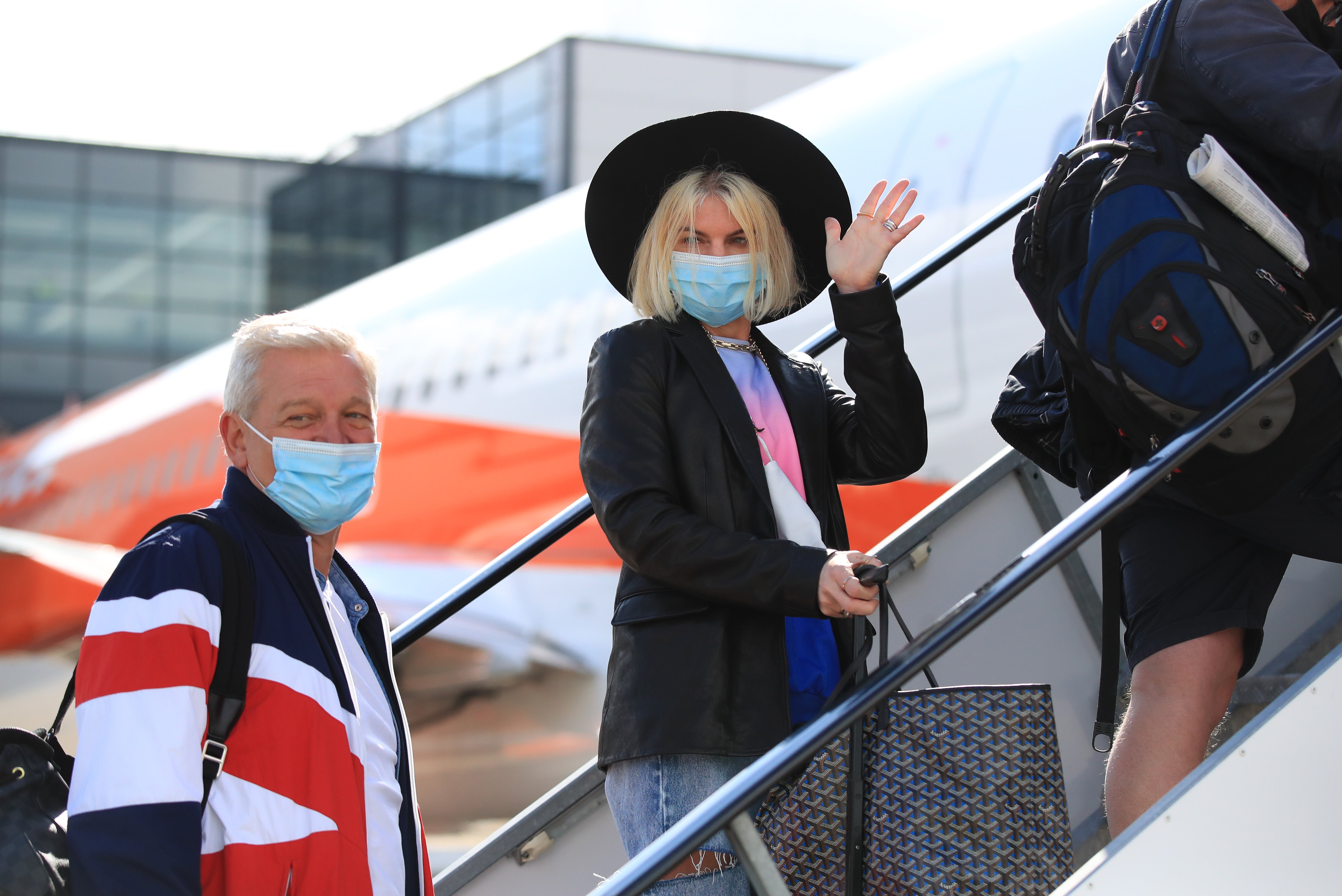 Passengers board a plane