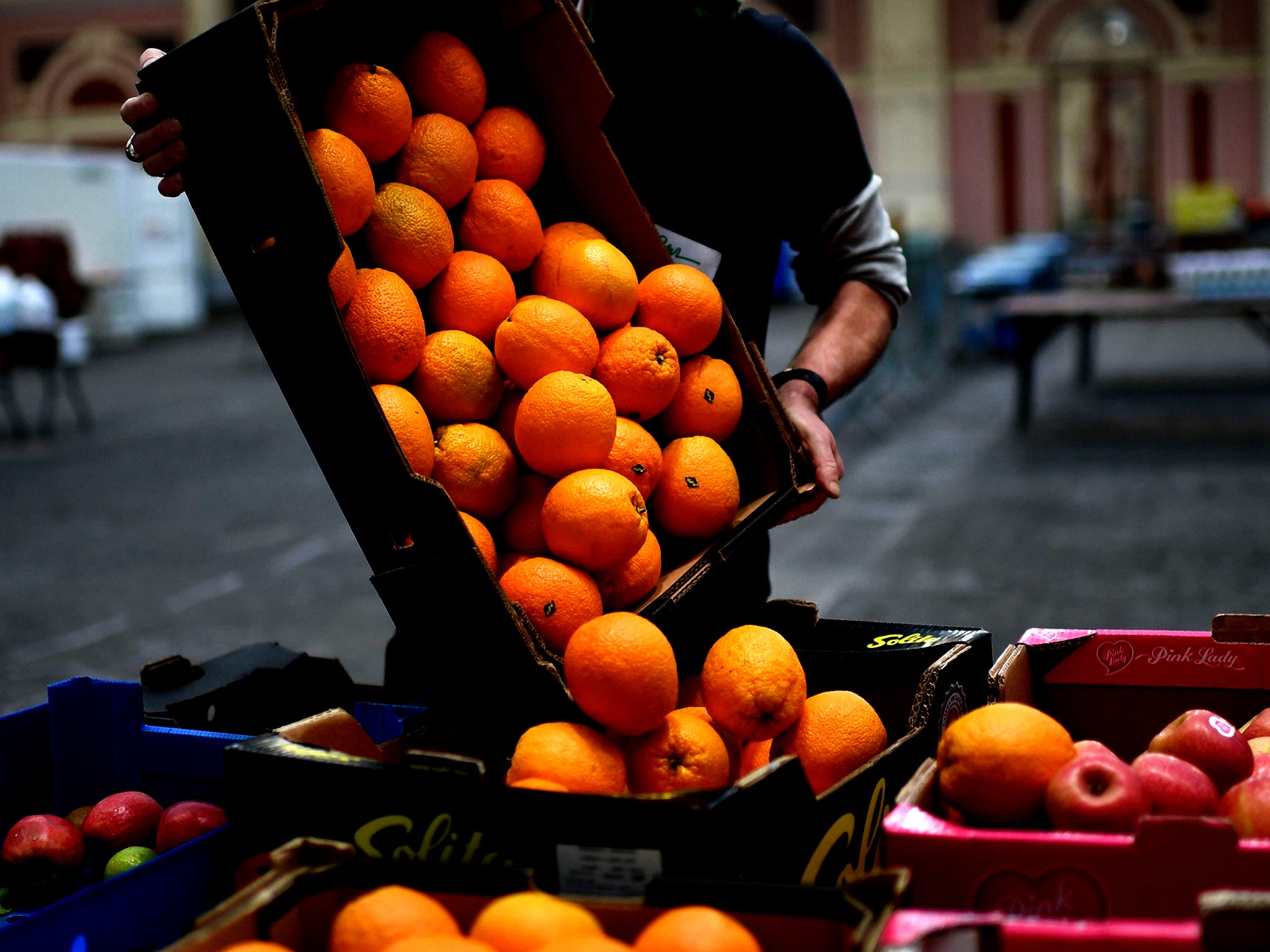 What a waste: While food is distributed from a food bank in London, 65,000 tonnes of surplus food is sent to waste plants