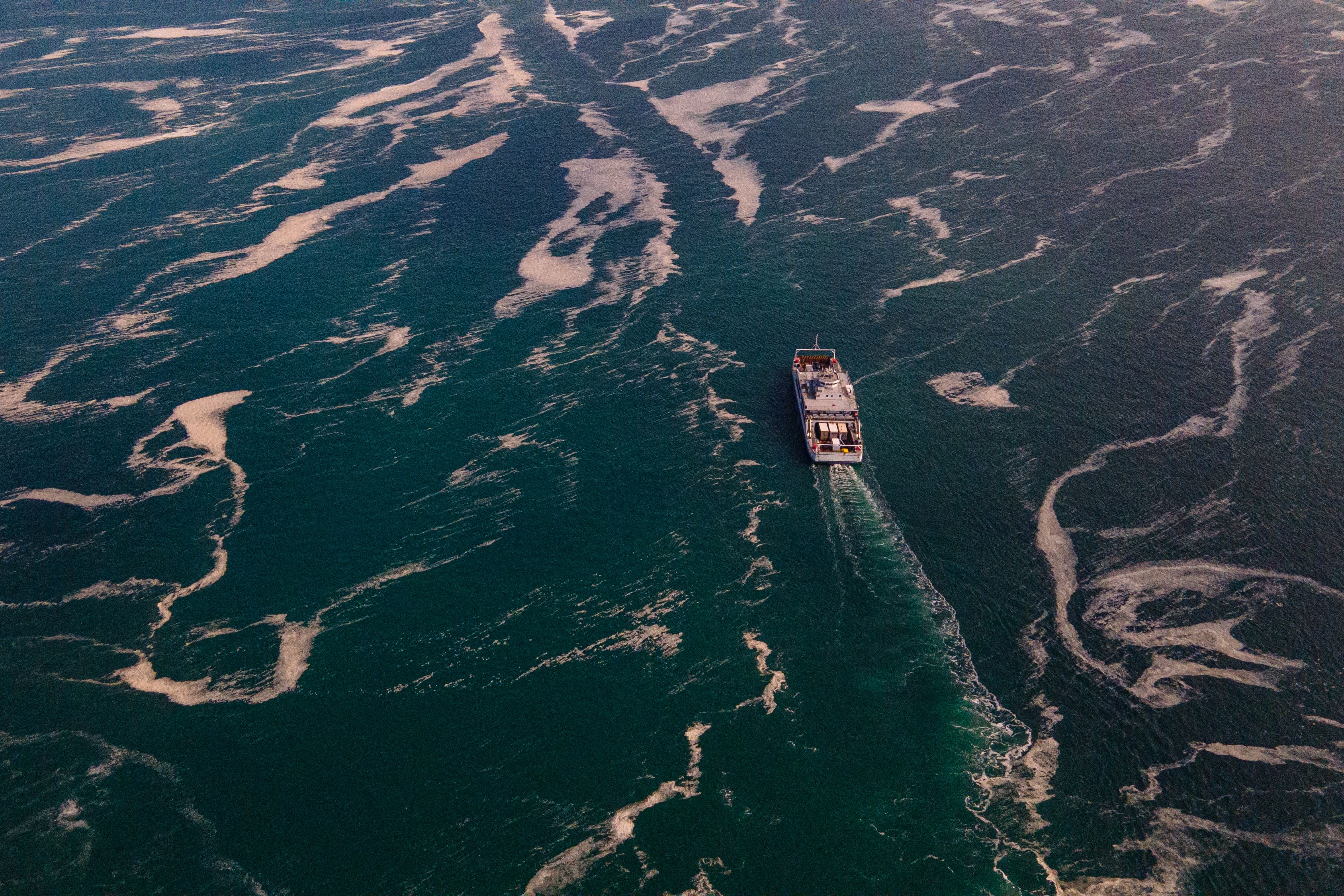 A boat sails across the Sea of Marmara which is covered with sea snot on 12 June, 2021.