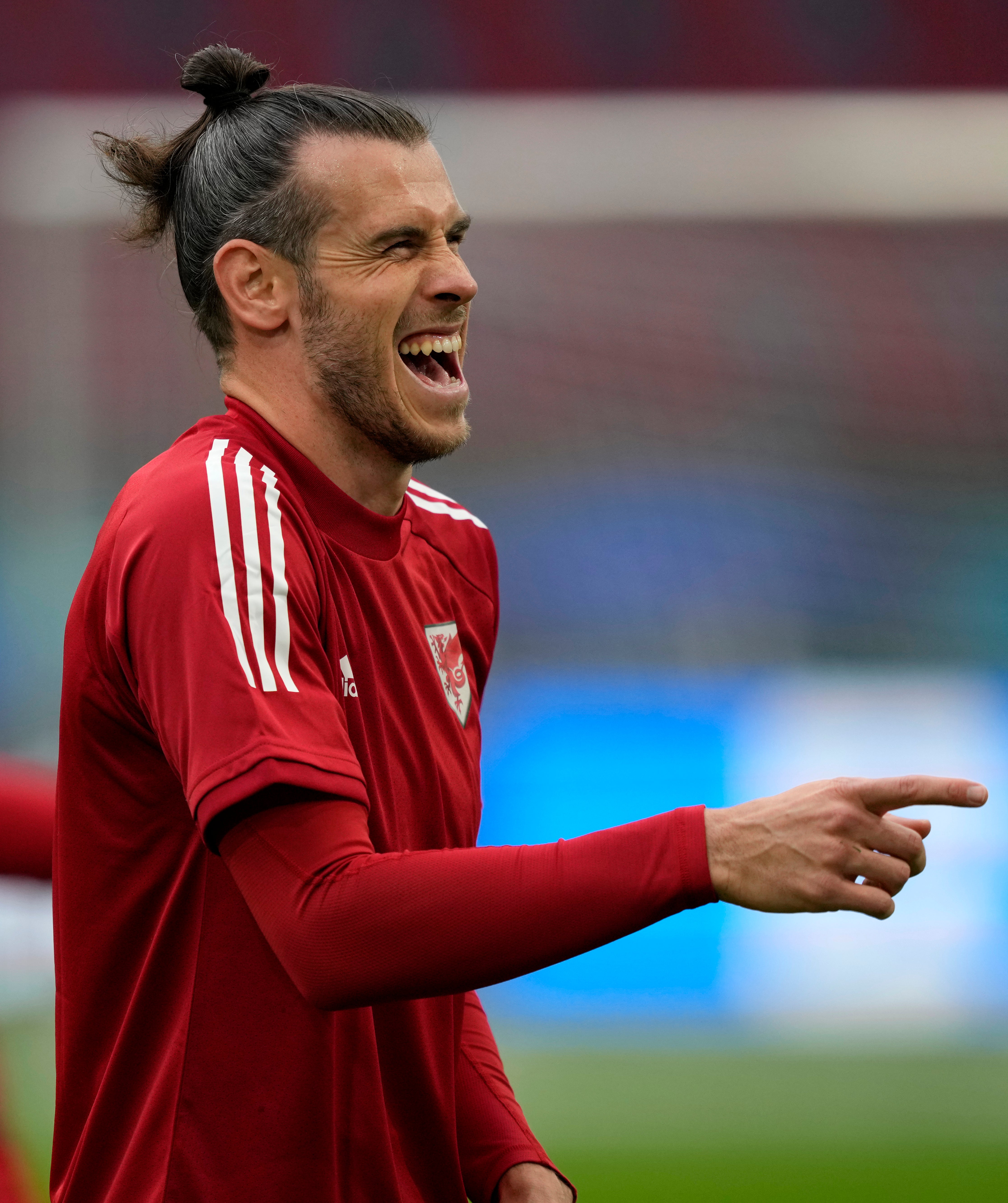 Wales forward Gareth Bale laughs during training