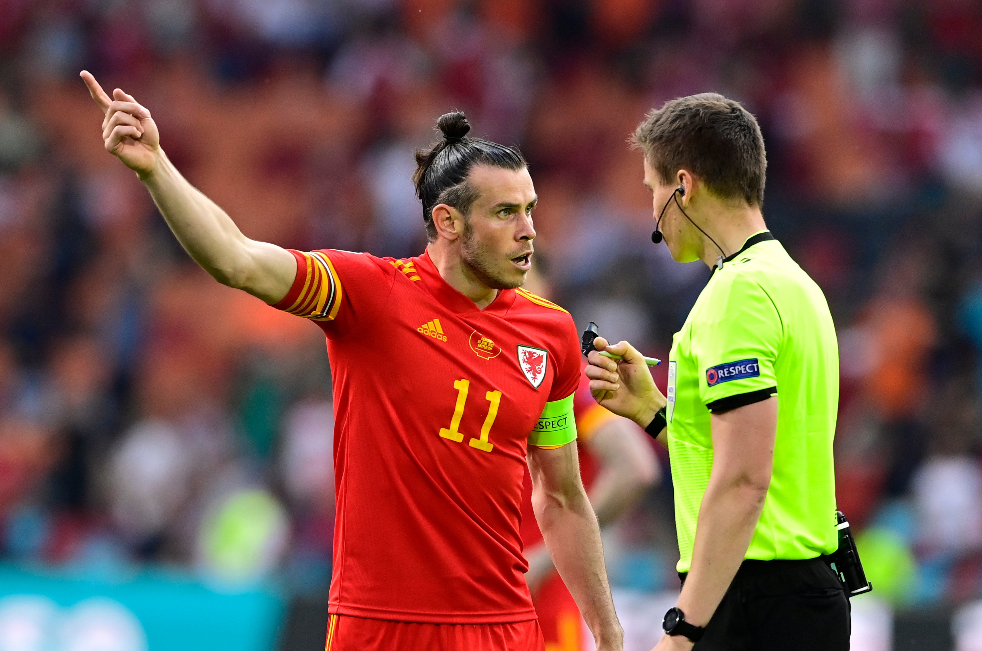 Wales’ Gareth Bale (left) argues with referee Daniel Siebert