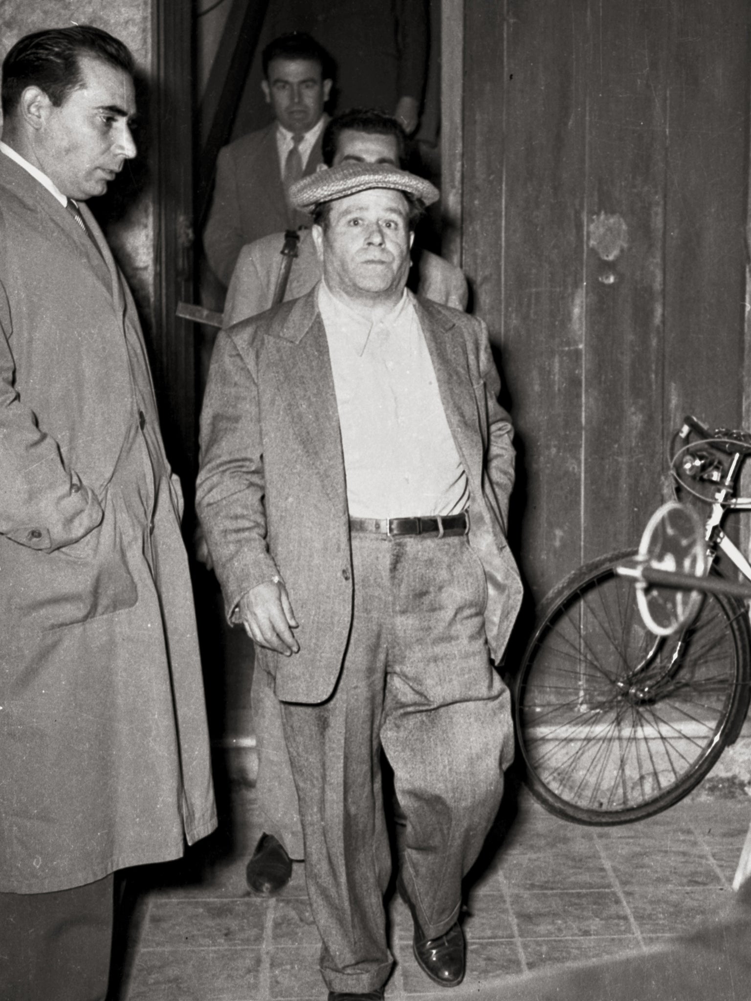 Italian mafioso Frank Coppola leaving his flat in Sicily in the 1940s